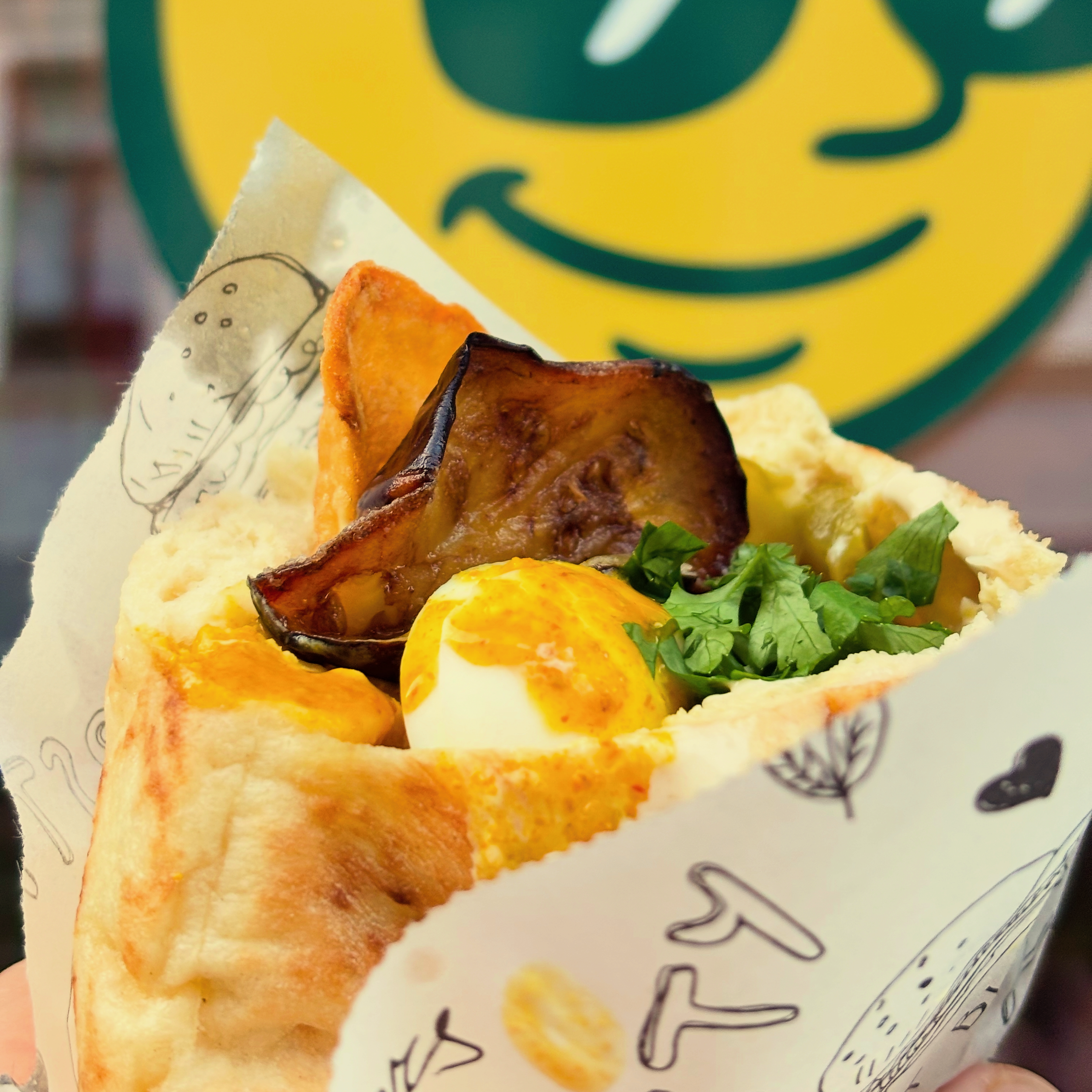 Sabich Pita with dripping Amba sauce