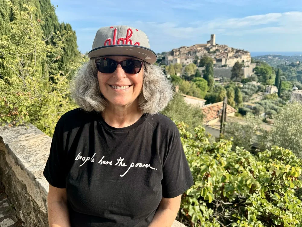 Yvette, smiling at the camera, member of the Kona Indivisible committee