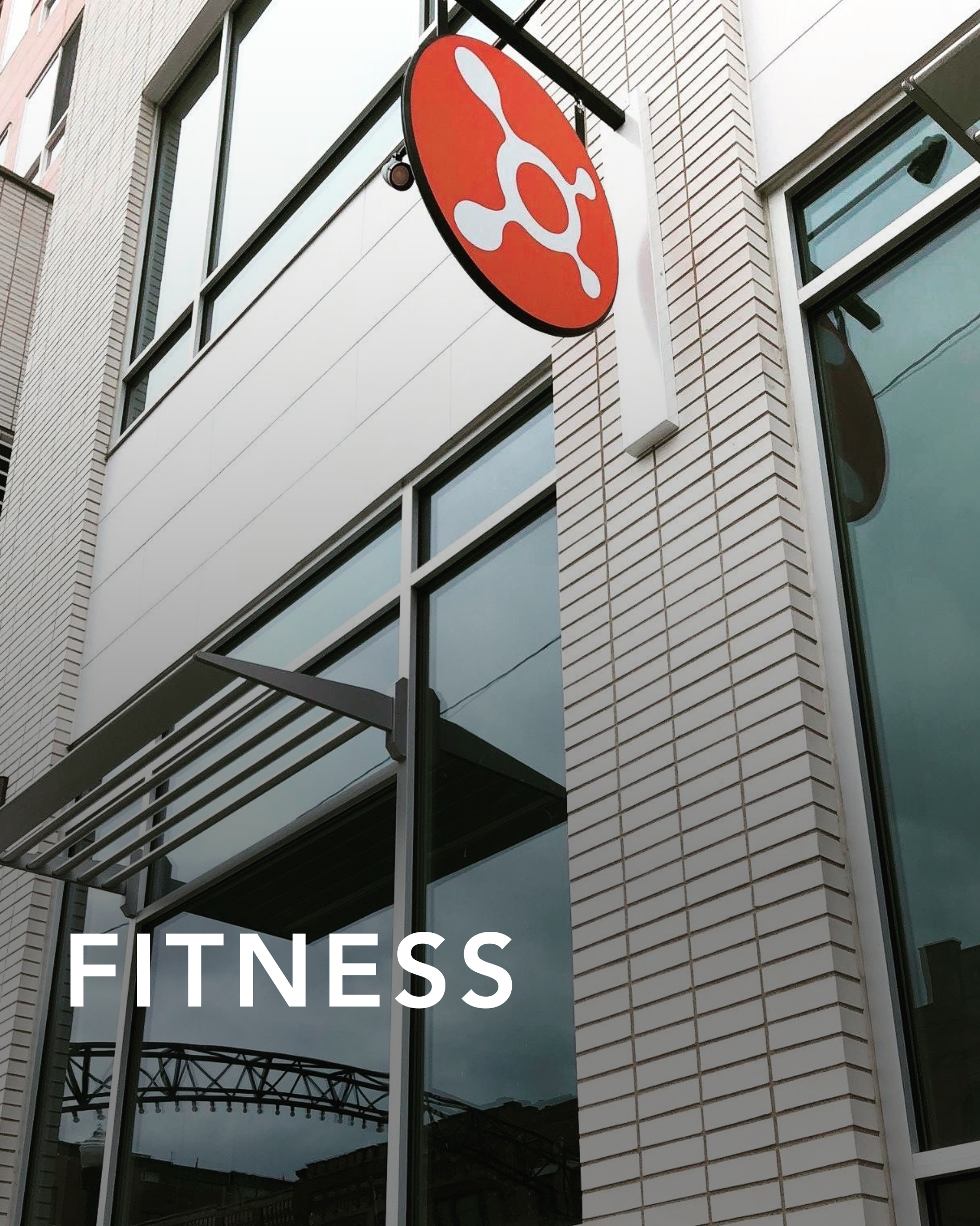 An outdoor sign with the orange theory logo on it showcasing the outdoor design created by CM Collaborative.