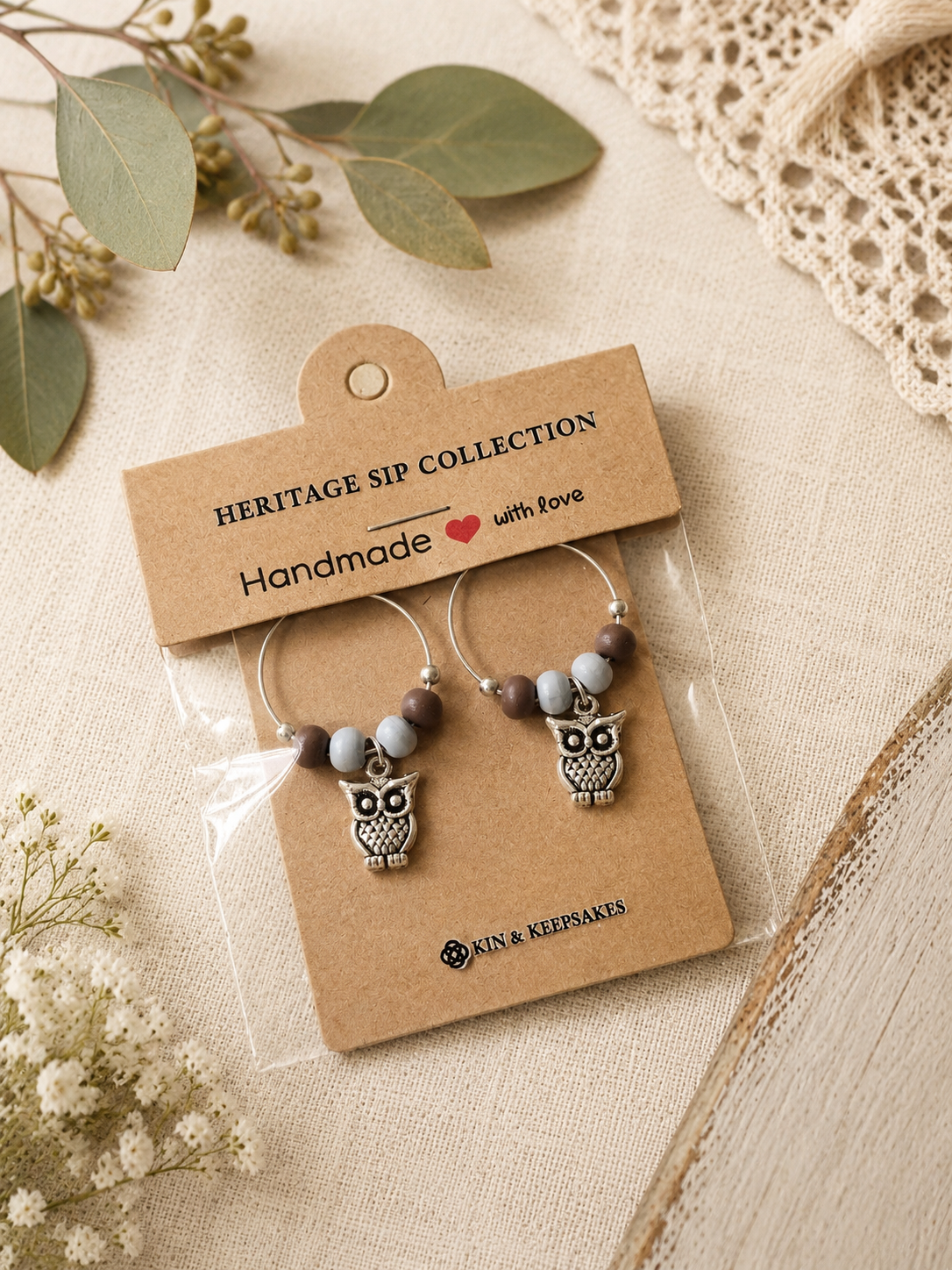 Feather & Sky wine charm duo presented in handmade gift packaging