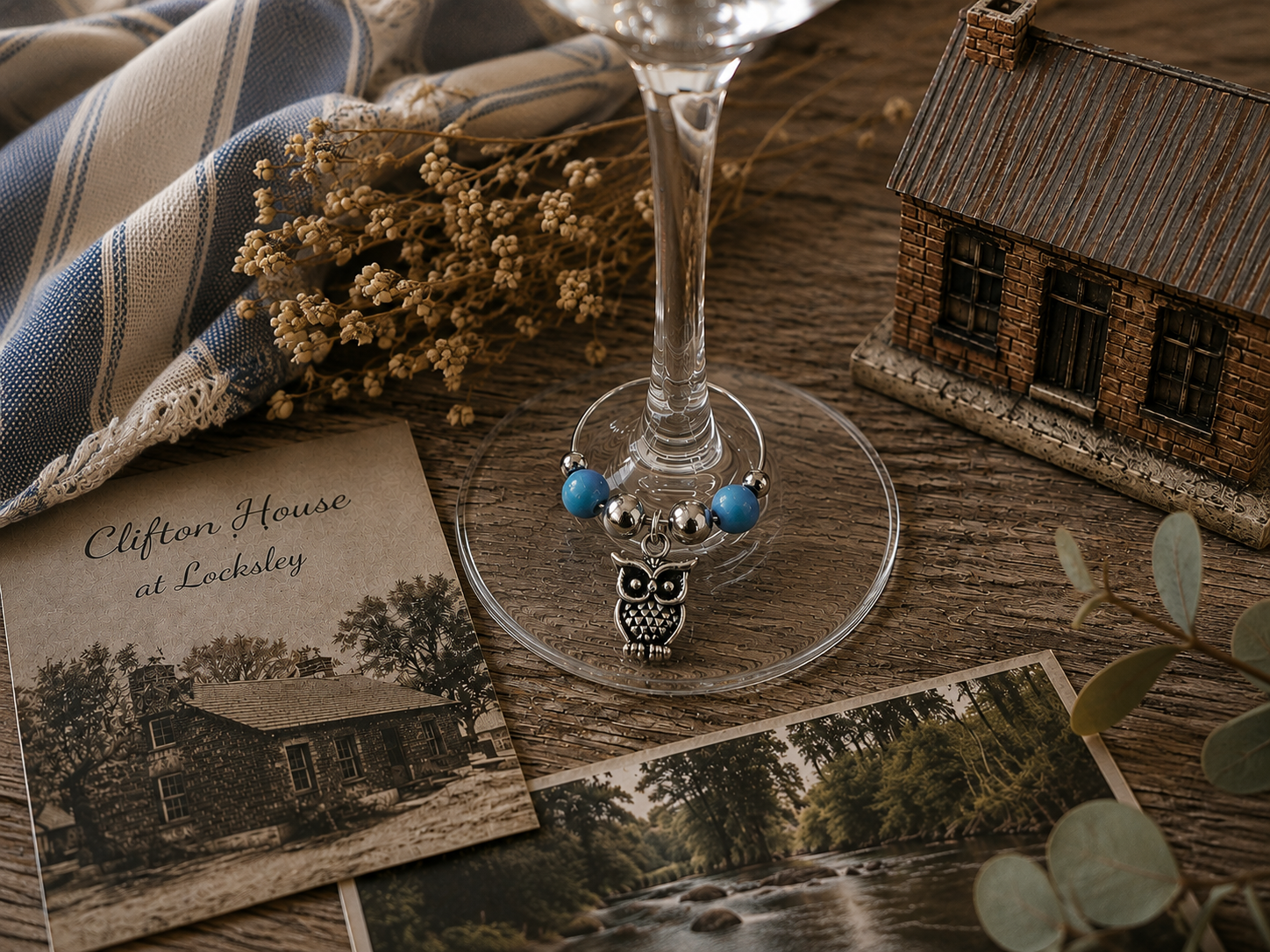 Springtime wine charm duo with silver owl charms and aqua beads displayed on a wine glass
