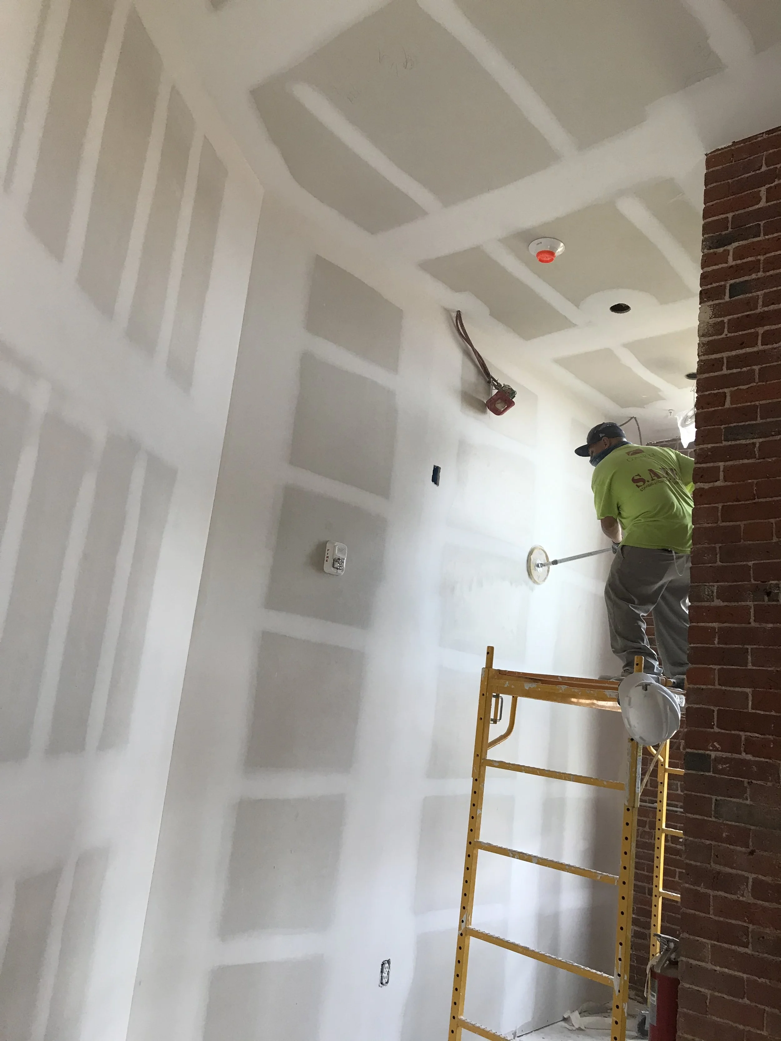 drywall and taping sanding worker.jpg