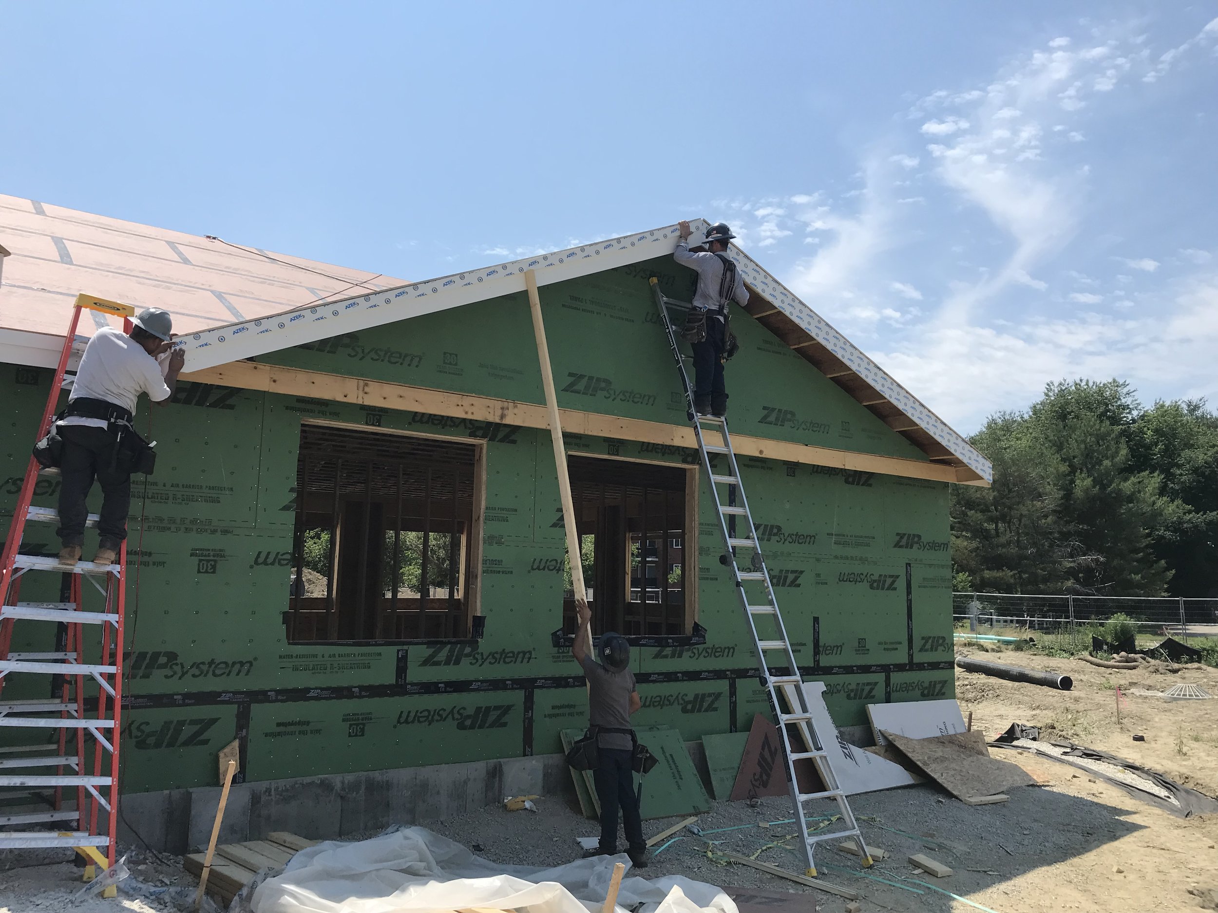 workers on ladder exterior construction.jpg