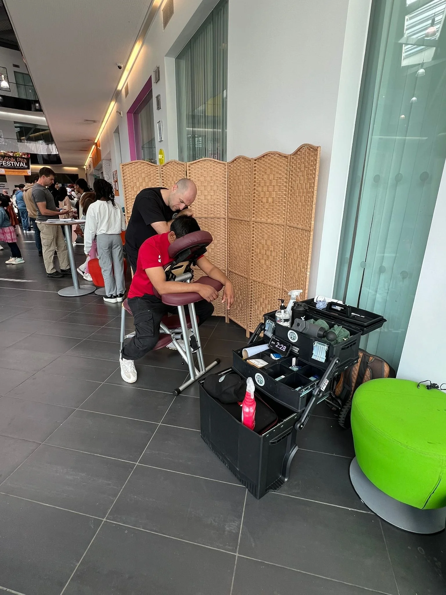 Mobile chair massage being administered on an event day