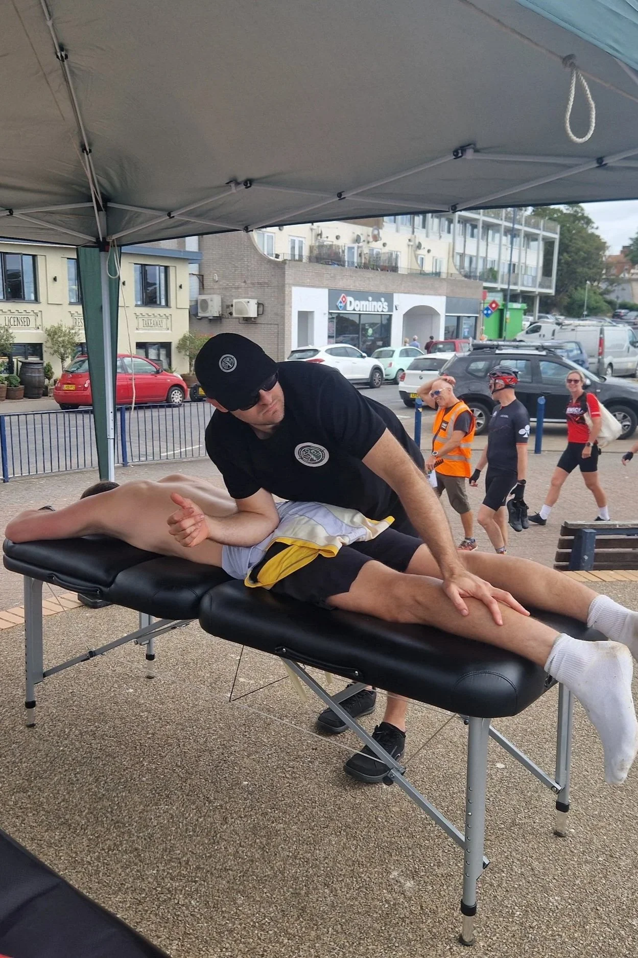 Sports Massage Treatment being delivered in an outdoor setting at Felixstowe Triathlon
