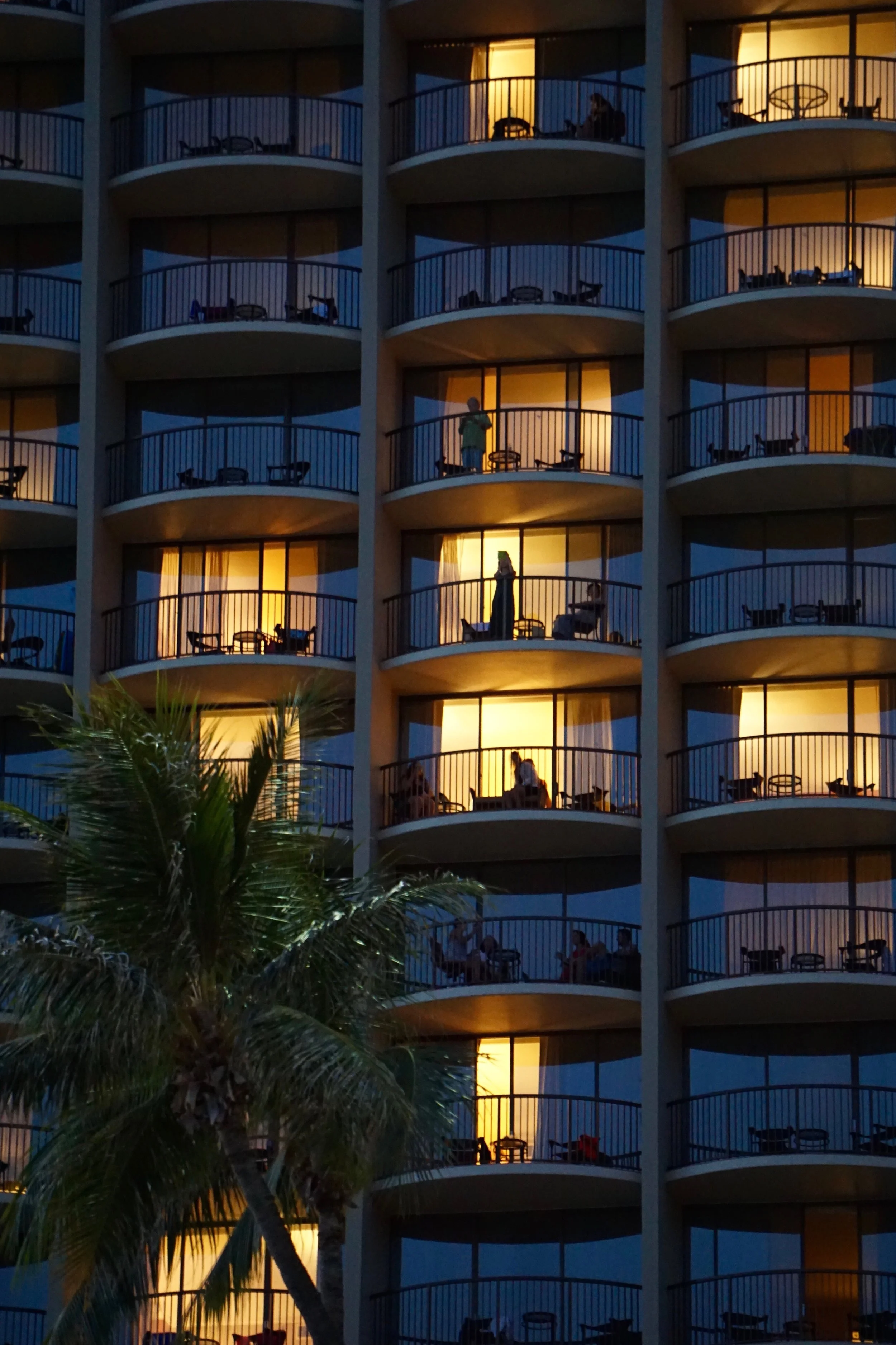 people-looking-out-of-hotel-condo-building-at-nigh-2024-10-16-14-29-10-utc.jpg