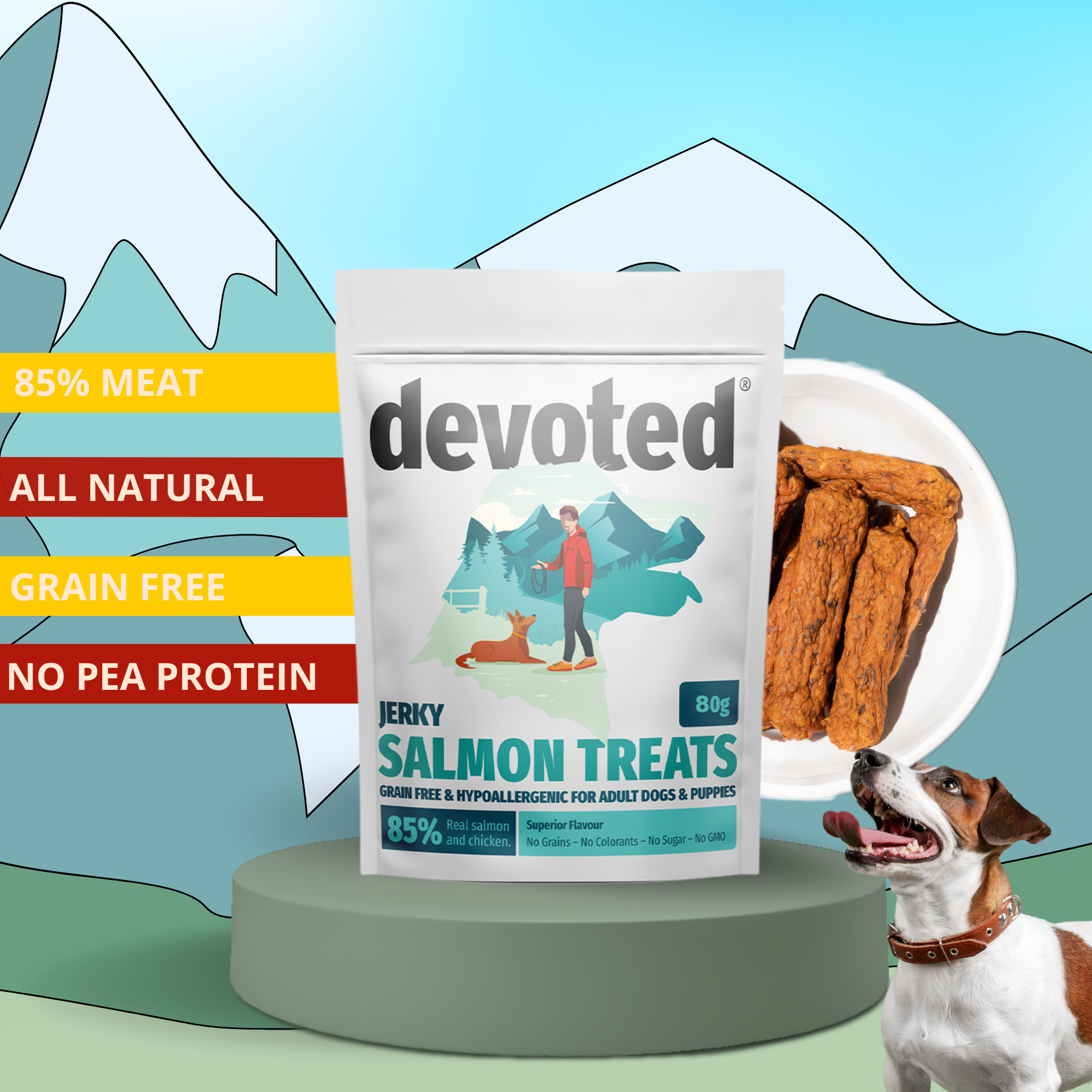 Bag of devoted salmon dog treats with a mountain landscape illustration, a bowl of the treats, and a happy dog in a collar, with labels listing treat features such as 85% meat, all natural, grain free, and no pea protein.