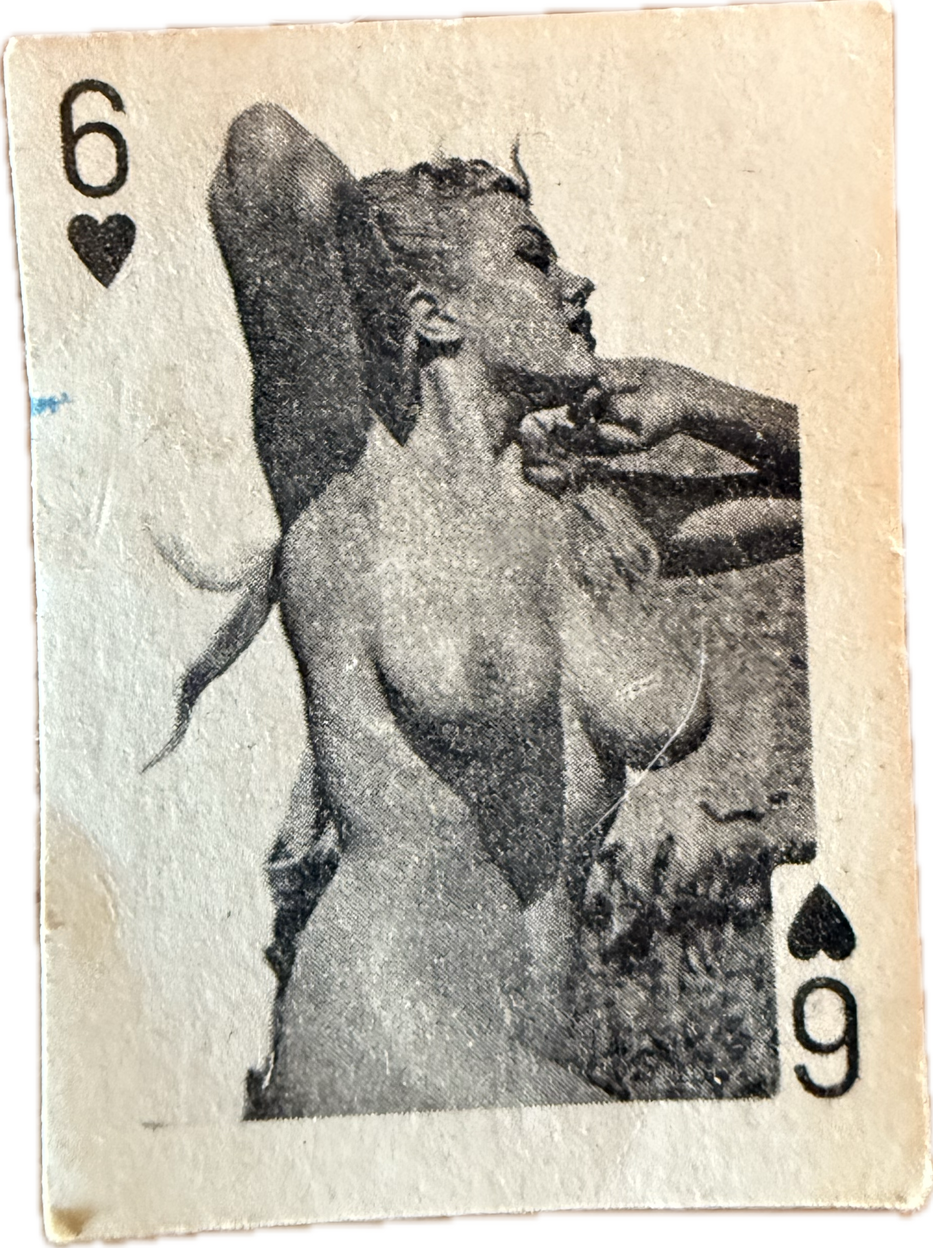 Vintage 6 of hearts playing card featuring a black-and-white photo in the center of a nude woman lying on her back with one arm behind her head. She has her eyes closed and appears relaxed.