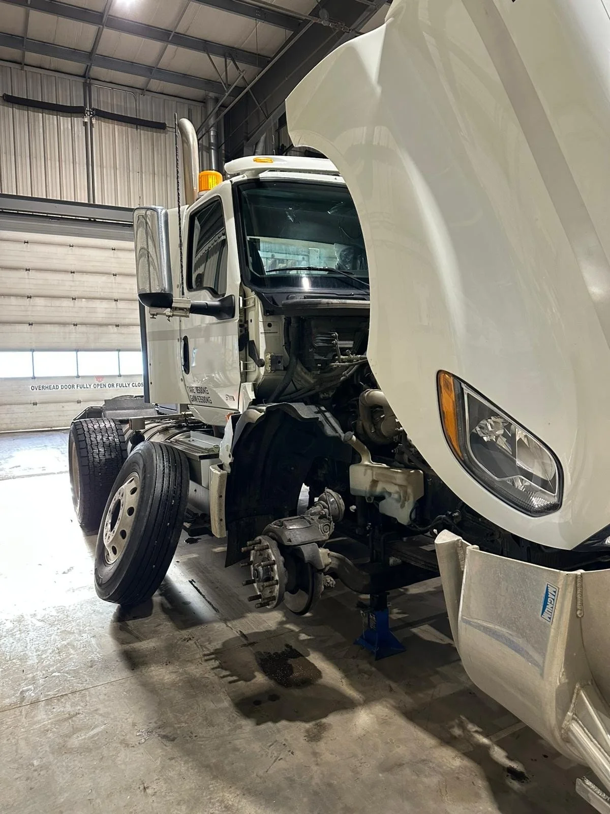 commercial truck undergoing mechanical repair at IRON 5 shop in Nisku Alberta