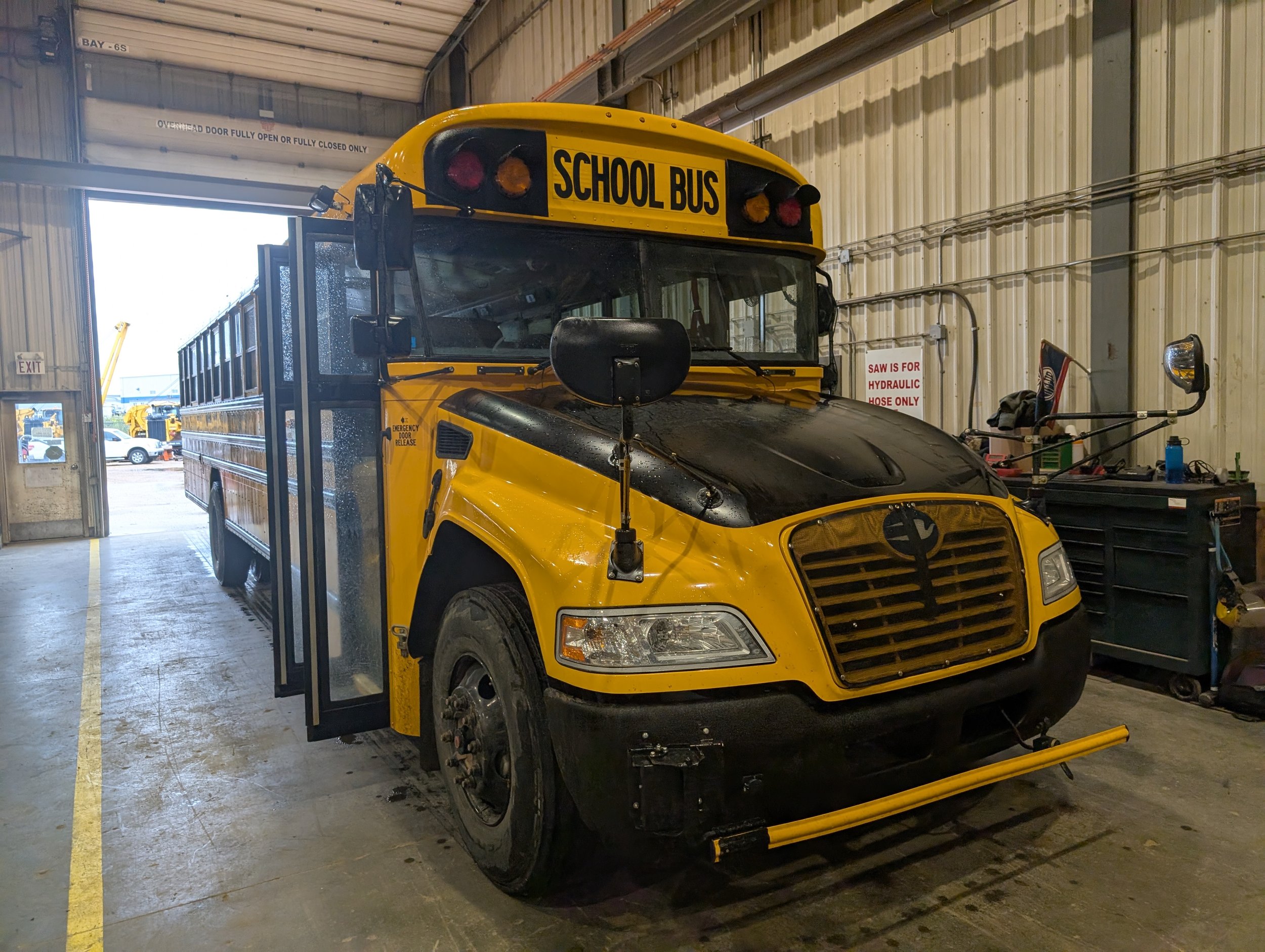 school bus undergoing inspection and mechanical service at IRON 5 shop in Nisku Alberta