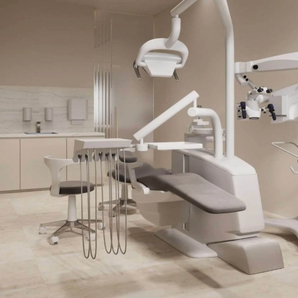 Empty dental examination chair with dental tools and overhead lights in a modern dental clinic.