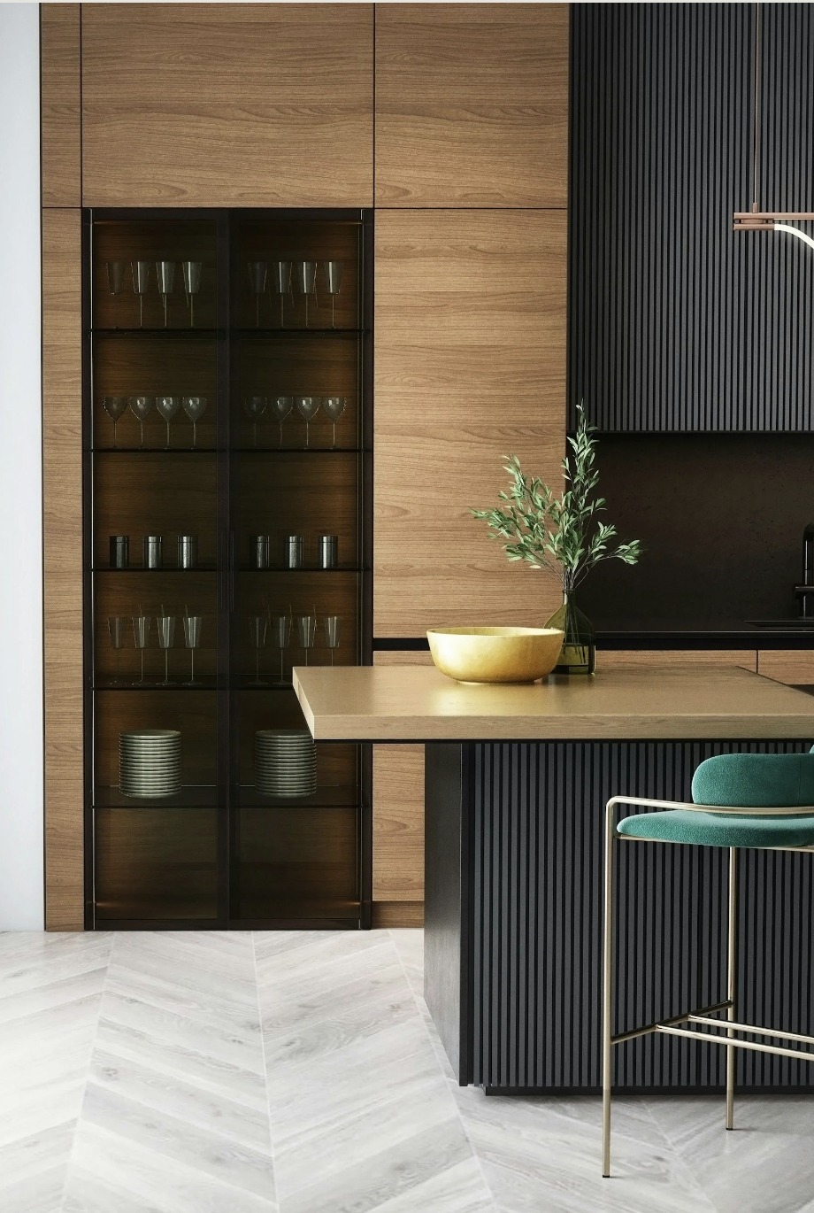 Modern kitchen with wooden and black paneled cabinets, a glass display cabinet with glassware and plates, a green upholstered chair, a wooden table with a yellow bowl and a vase with green foliage