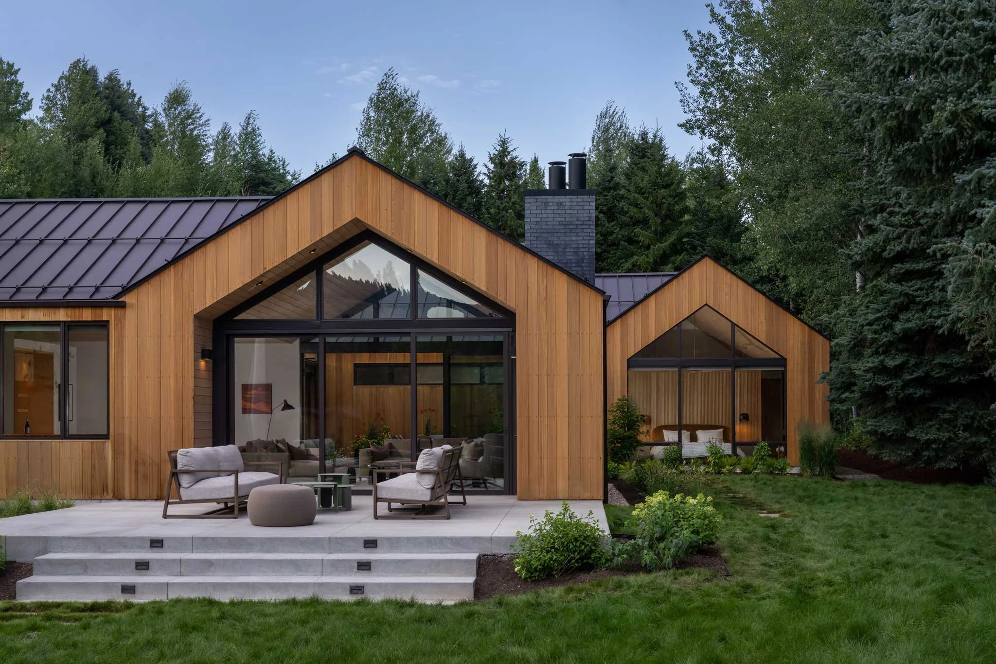 modern home in the mountains with large glass doors
