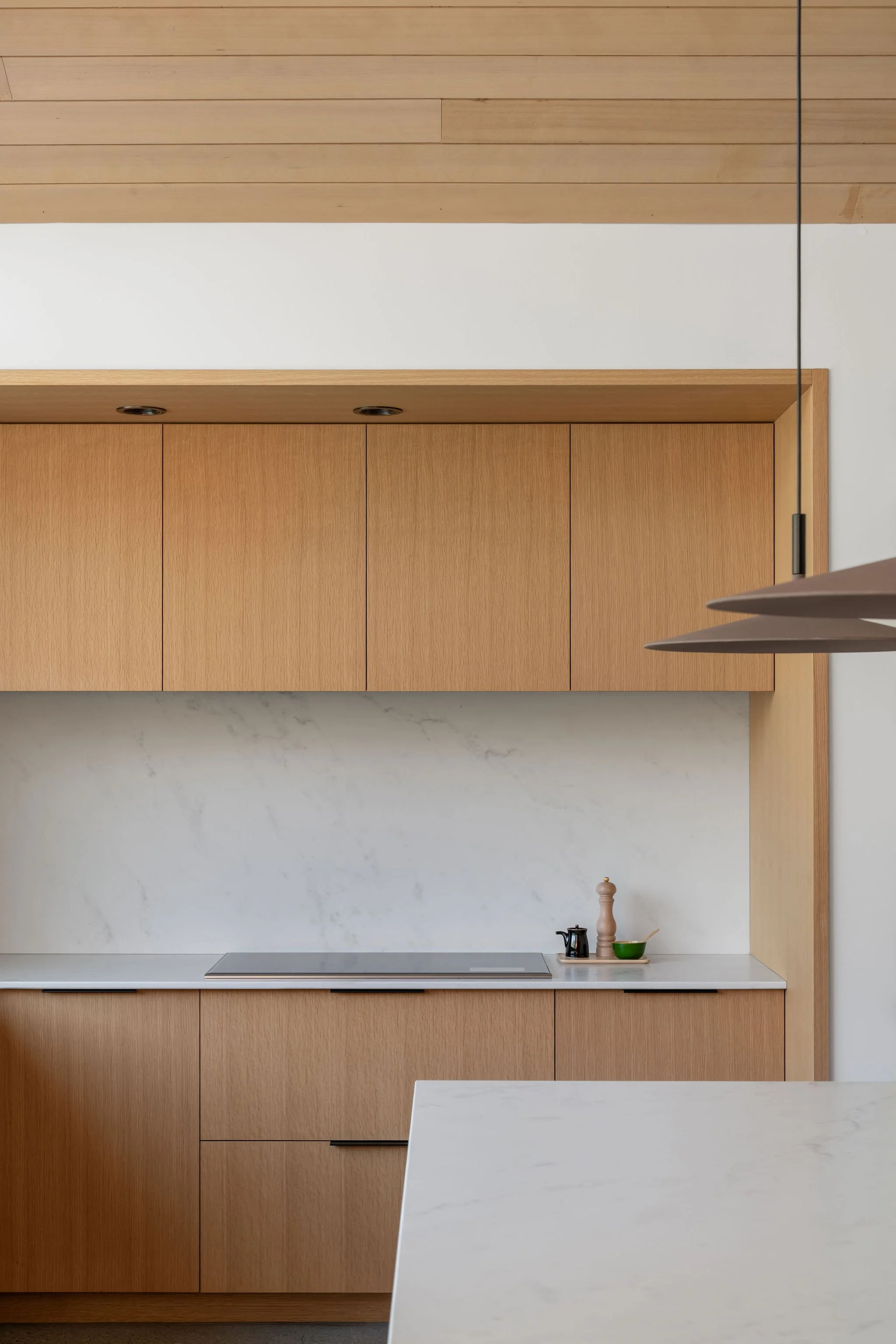 simple modern kitchen with wood cabinetry