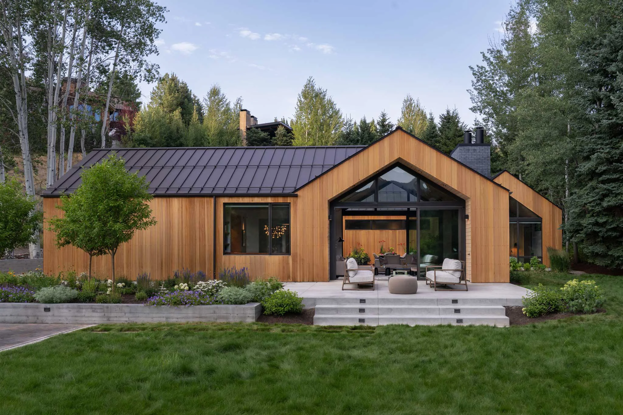 custom home in the mountains connecting to outdoor patio