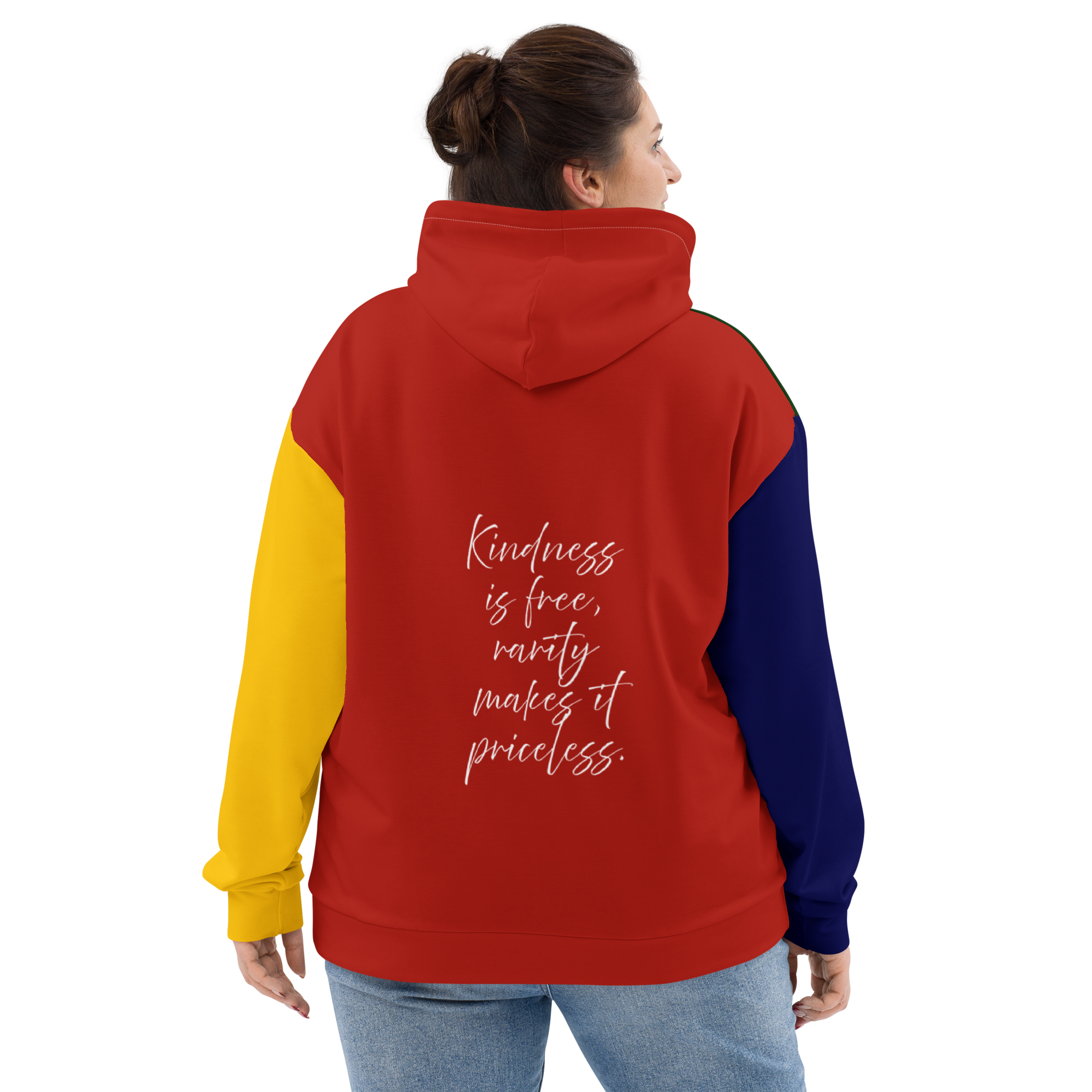 Back view of a person wearing a red, yellow, and blue color-blocked hoodie with the quote 'Kindness is free, rarity makes it priceless' printed on the back.