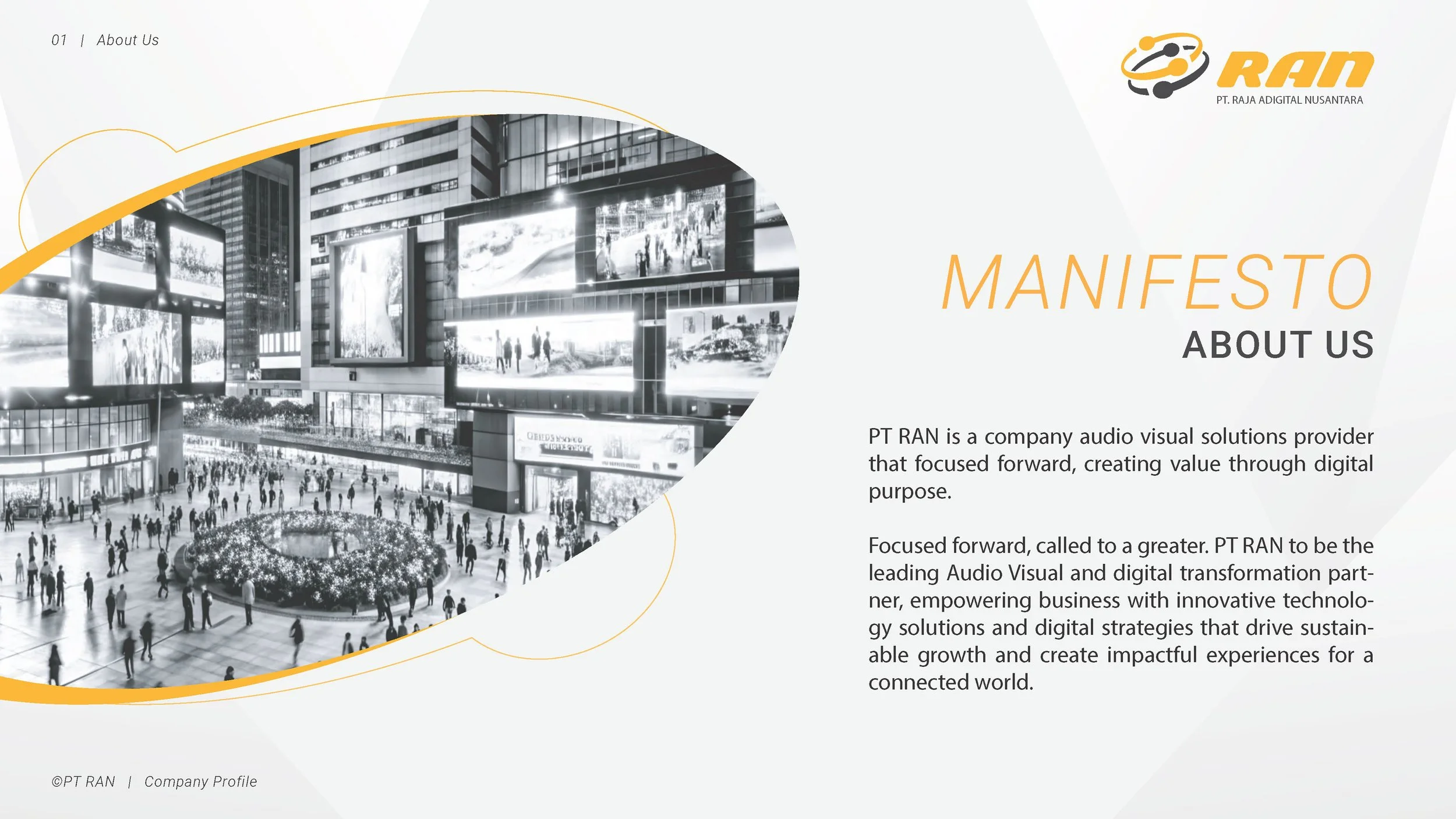 A black and white digital rendering of a bustling city square with tall buildings, large digital billboards, and many people walking around and gathering near a circular garden in the center. The right side of the image features the company's name 'PT RAN' and a description of their focus on digital and audio visual solutions.