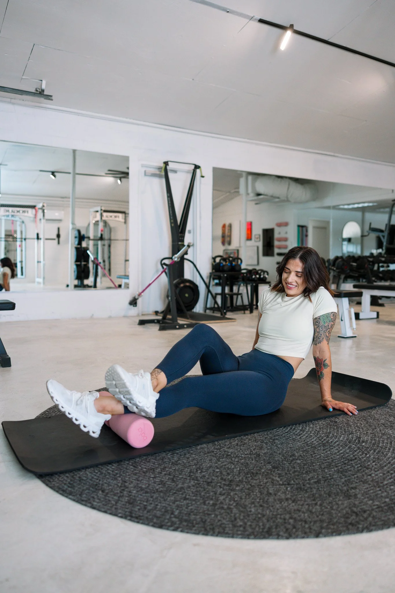 Stacia Evans using a foam roller for mobility and recovery work