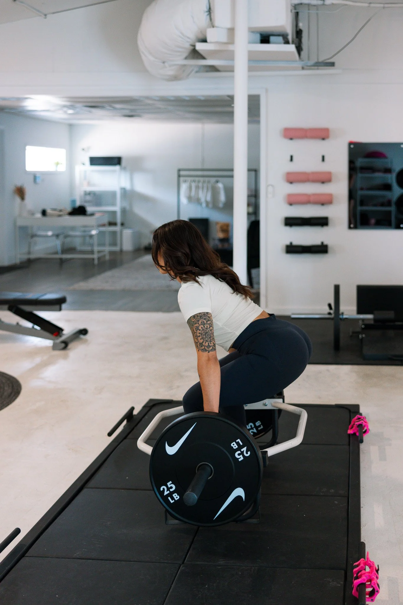 Stacia Evans demonstrating a strength exercise on a training mat