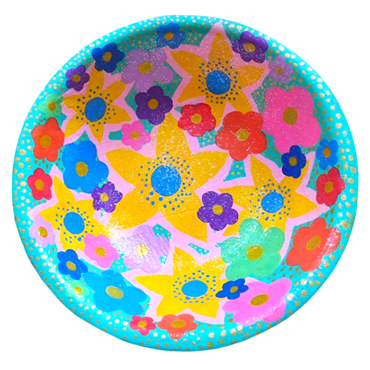 Colourful hand-painted wooden bowl with floral design, featuring yellow, pink, purple, blue, red, and green flowers on a turquoise background with gold dots.