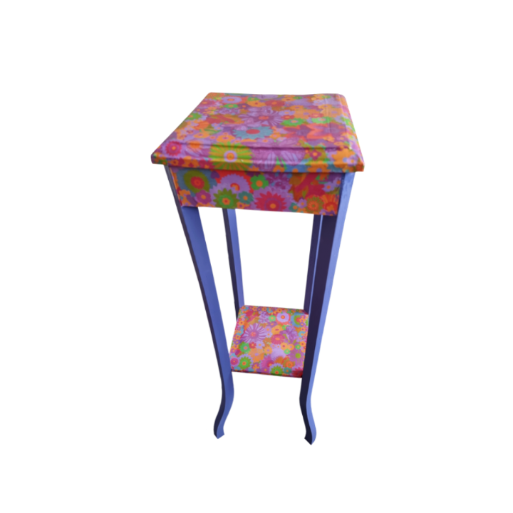 Colourful flower-patterned side table with a floral decoupage top and shelf, and blue curved legs.