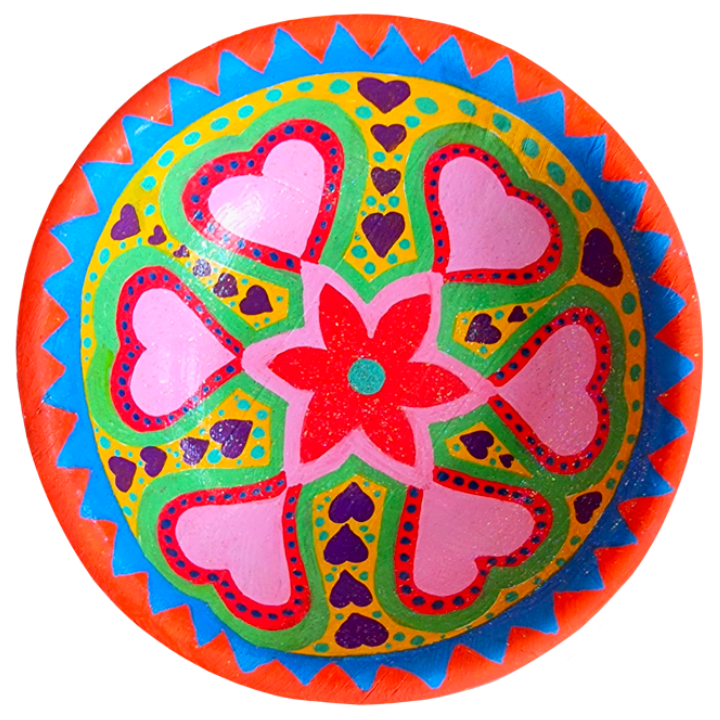 Colourful decorative bowl with a central red flower surrounded by pink hearts, green and yellow patterns, purple hearts, and a red and blue zigzag border.