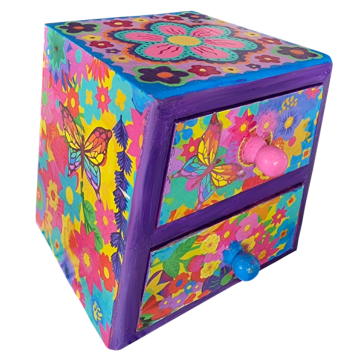 Colourful, hand-painted wooden jewellery box decorated with butterfly and flower patterns in pink, yellow, purple, blue, and green, featuring floral motifs and butterfly designs, with pink and blue knobs on the drawers.