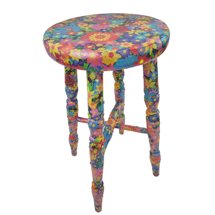 Colourful floral patterned stool with four legs and circular seat.