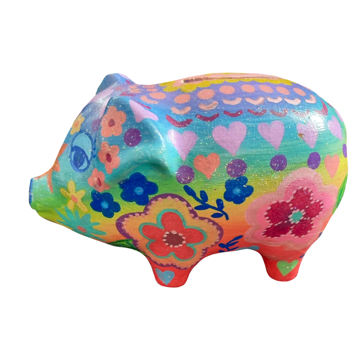 Colorful pig-shaped figurine decorated with floral and heart patterns