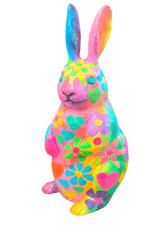 Colourful rabbit figurine decorated with bright, multicoloured floral and heart patterns
