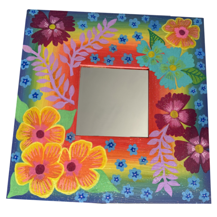 Colourful hand-painted picture frame decorated with flowers and leaves, featuring a bright rainbow background and a mirror in the center.