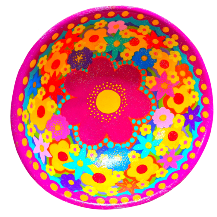 Brightly Coloured bowl featuring various stylized flowers, with a large pink flower at the center surrounded by smaller yellow, purple, blue, and orange flowers, set against a pink background.