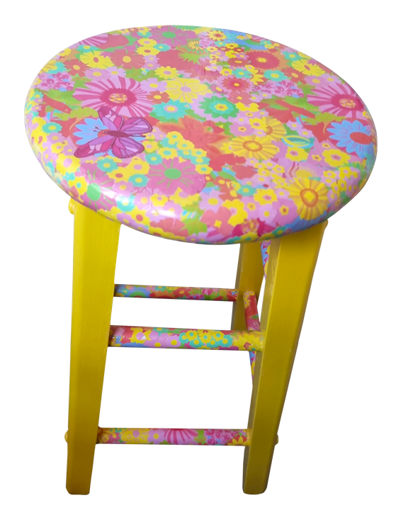 A small stool with a round, floral-patterned seat in pink, yellow, purple, and blue flowers, and yellow legs connected by colorful bars.