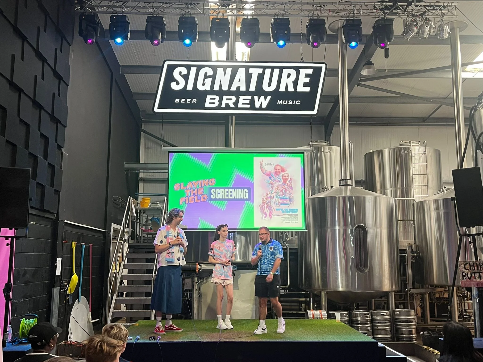 Director Cameron Richards, TRUK United player Emily and Director Charlie Tidmas during a Q&A after a screening of We'll Go Down in History