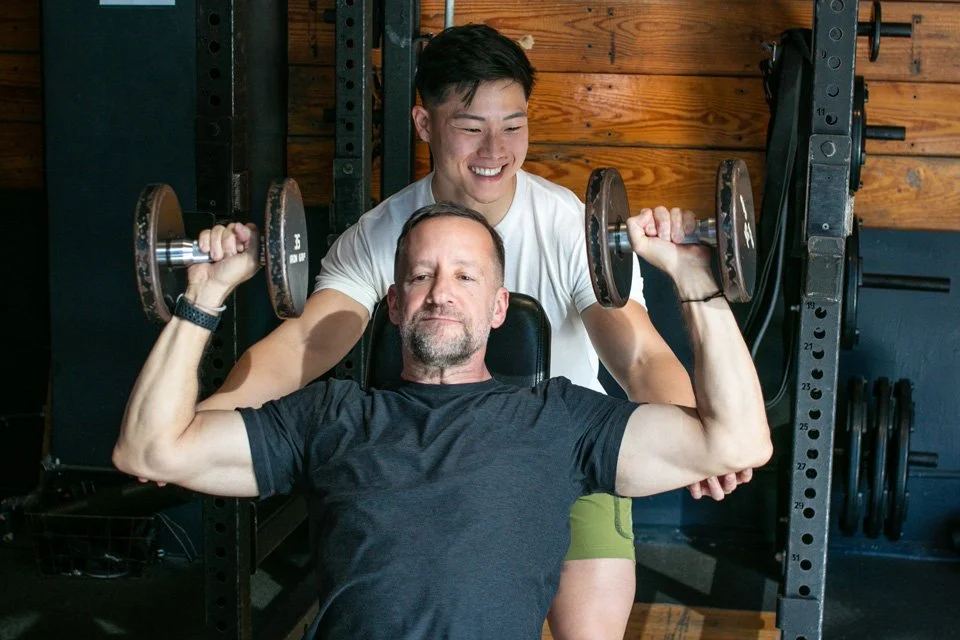 Personal Trainer in San Francisco SOMA neighborhood working with client on strength training.