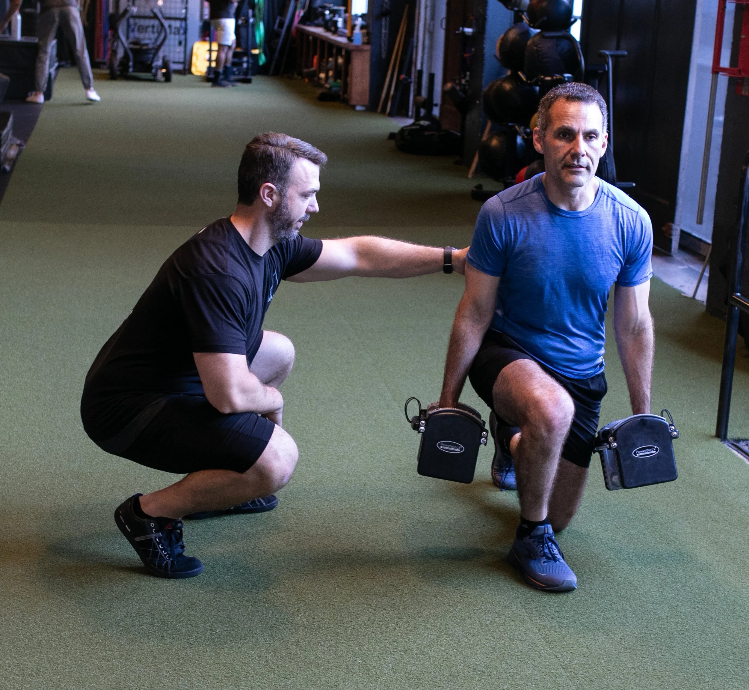 Personal Trainer in San Francisco SOMA neighborhood working with client on strength training.