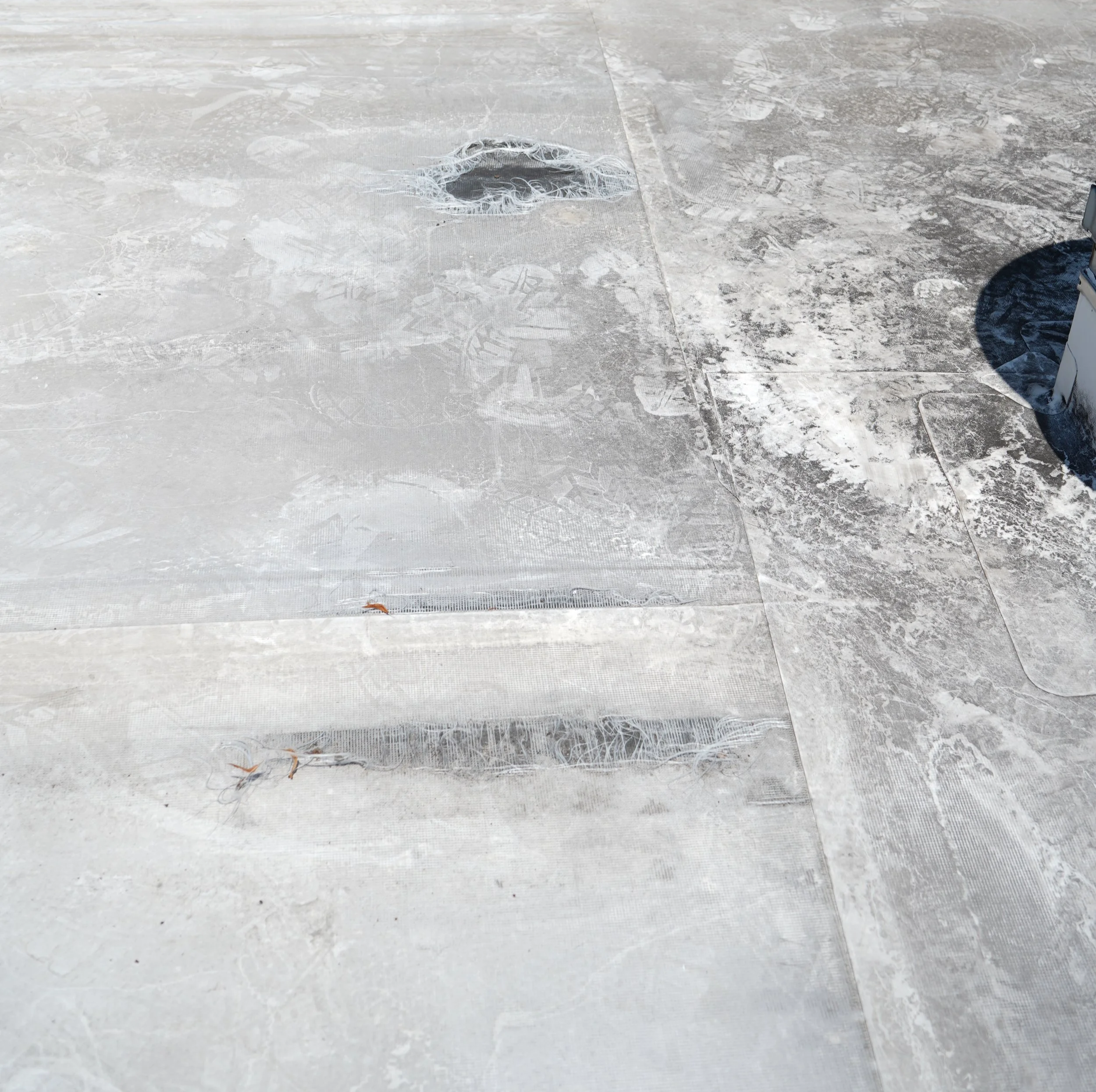 Roof membrane that delaminated and needs to be replaced.