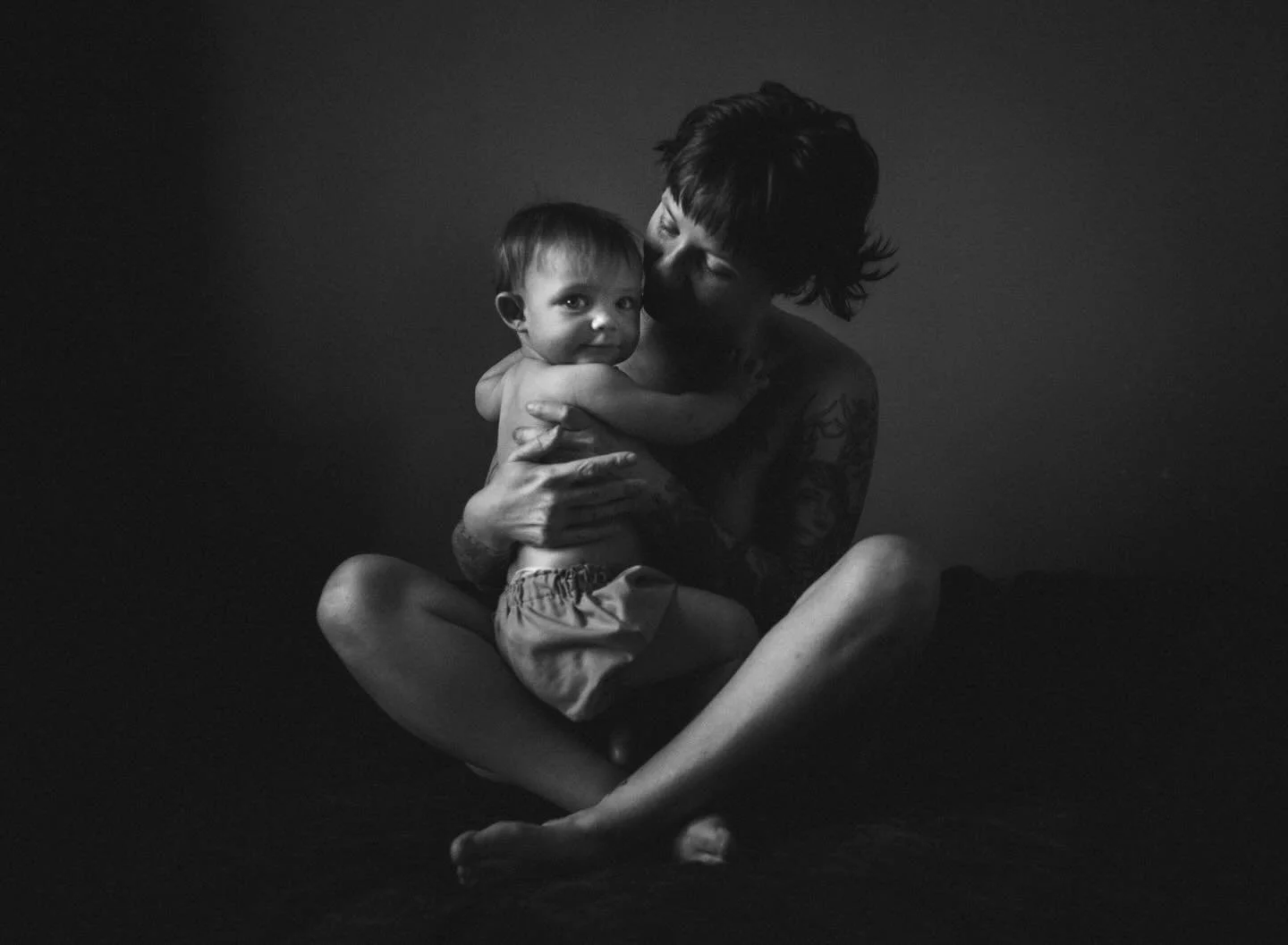 She had other plans. We were trying to document a quiet moment between them and this little one decided that the camera was more interesting than anything else in the room. So we followed her lead. And somewhere between the wiggling and the wandering