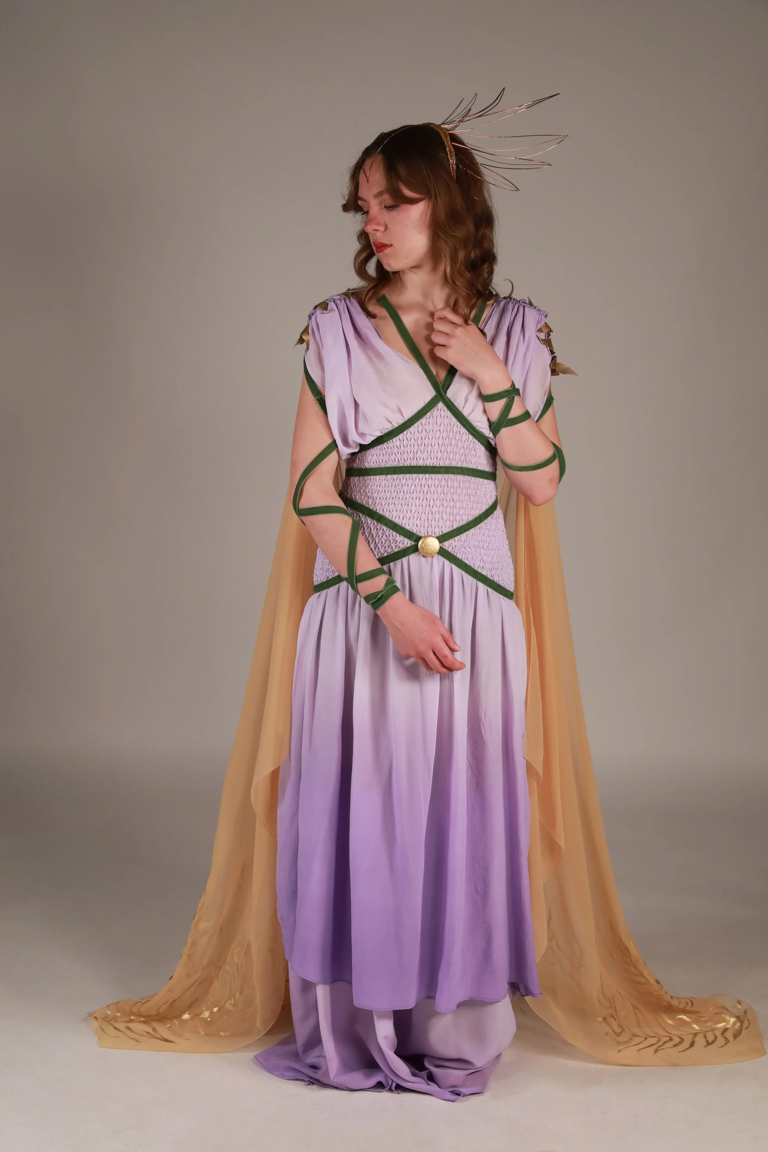 Hebe is the Greek goddess of eternal youth and is often featured with the symbol of her father the Eagle of Jupiter. This Costume pulls inspiration from classical Greek drapery and mixes it with more modern means of fabric manipulation and decoration