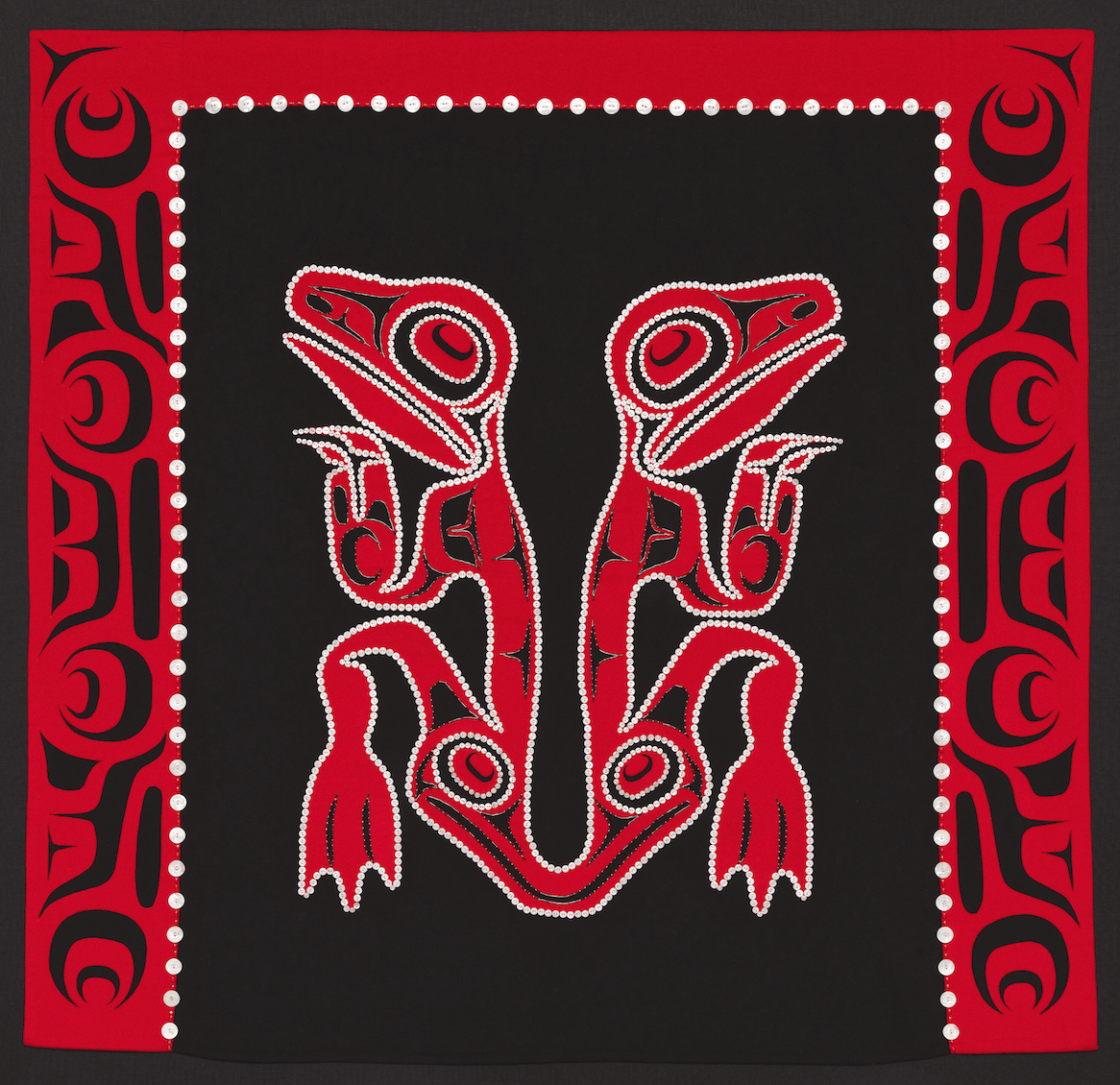  Dorothy Grant (Kaigani Haida, b. 1955) (Maker) Robert Davidson (Haida, b. 1946) (Designer) Robe, 1992 Cashmere wool; fulled, appliqué, reverse appliqué, applied mother-of-pearl buttons, and glass beads, 56 1/2 x 58 13/16 x 5/16 in. Photo Randy Dodso