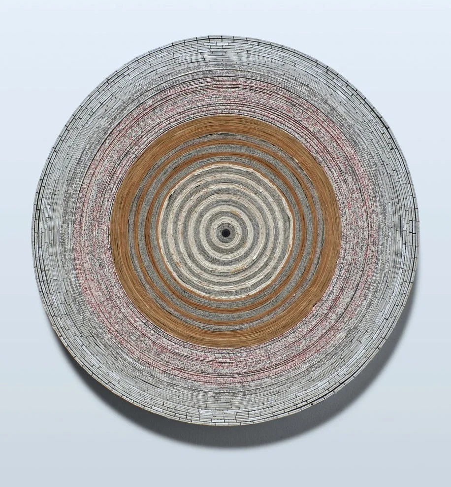 "First Book no 5", Paper and covers from one Bible, museum board, and heritage corrugated board. Diameter: 21.5 Thickness: 2