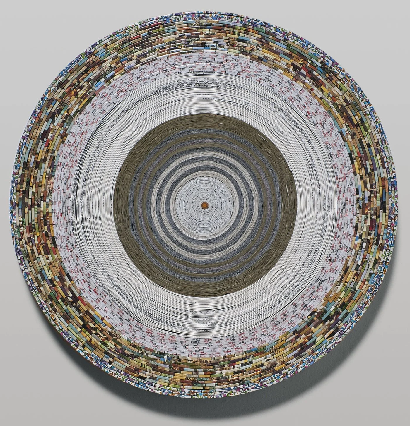 "First Book no 8", Paper and covers from one Bible, museum board, and heritage corrugated board. Diameter: 16.25 Thickness: 2