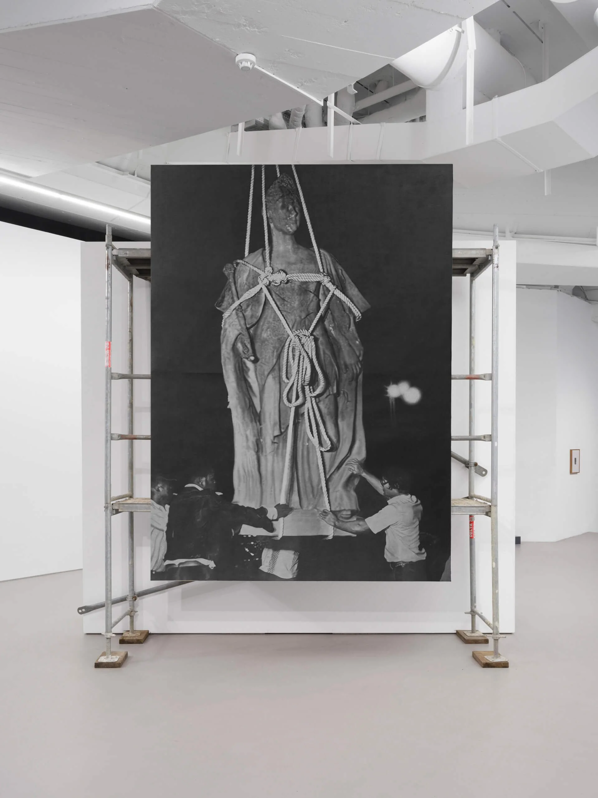   Removal of the statue of Queen Wilhelmina from Independence Square, Paramaribo, Suriname. 1975. right: visual artist Stuart Robles de Medina. Stichting Surinaams Museum. Archive nr. 20–162 , 2024, acrylic on canvas, metal scaffold, 320 × 232 cm 