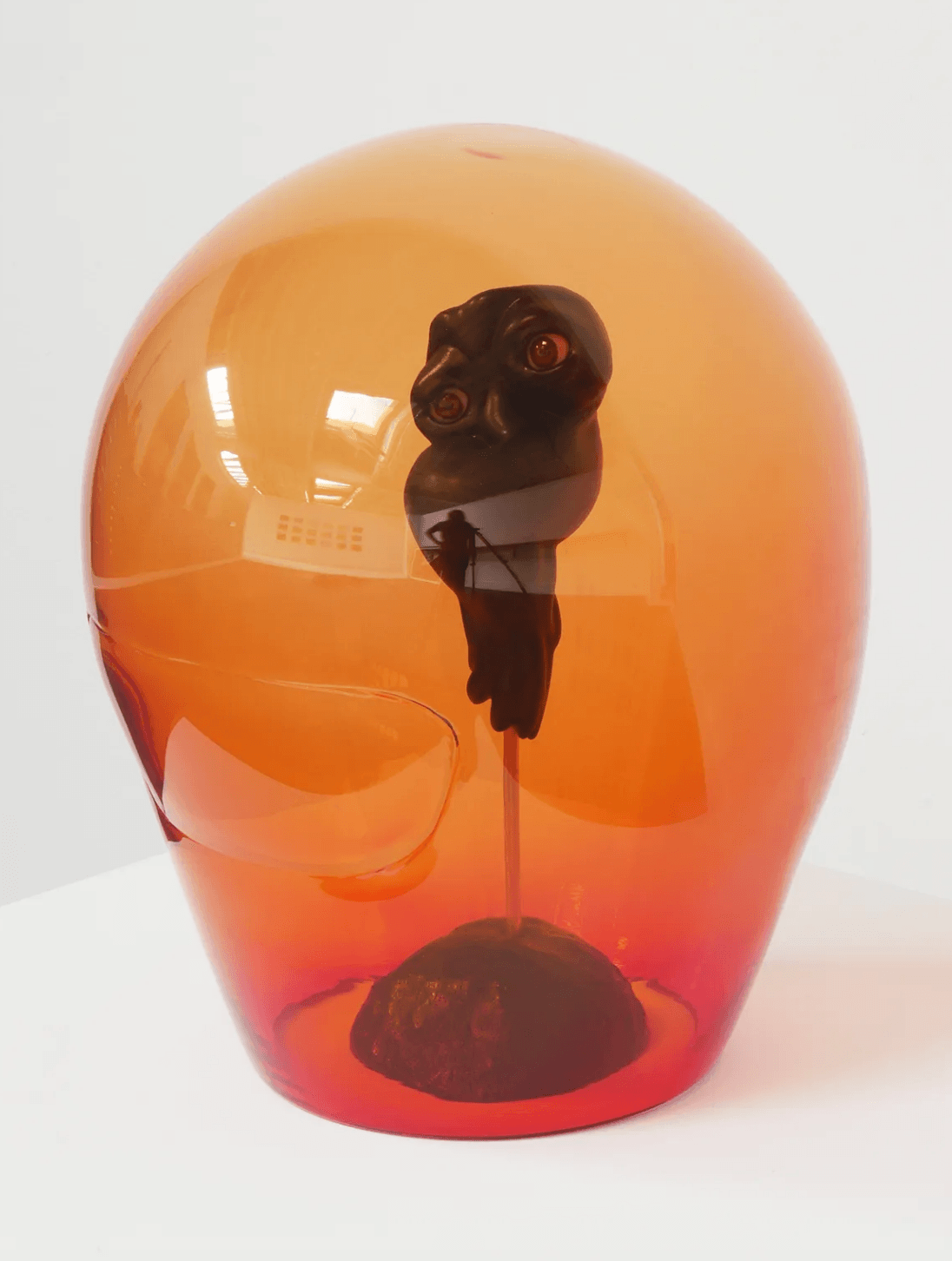 Helmed Spirit of Benevolence, 2026 glass, resin, brass, concrete 15 x 12 x 12 1/2 in