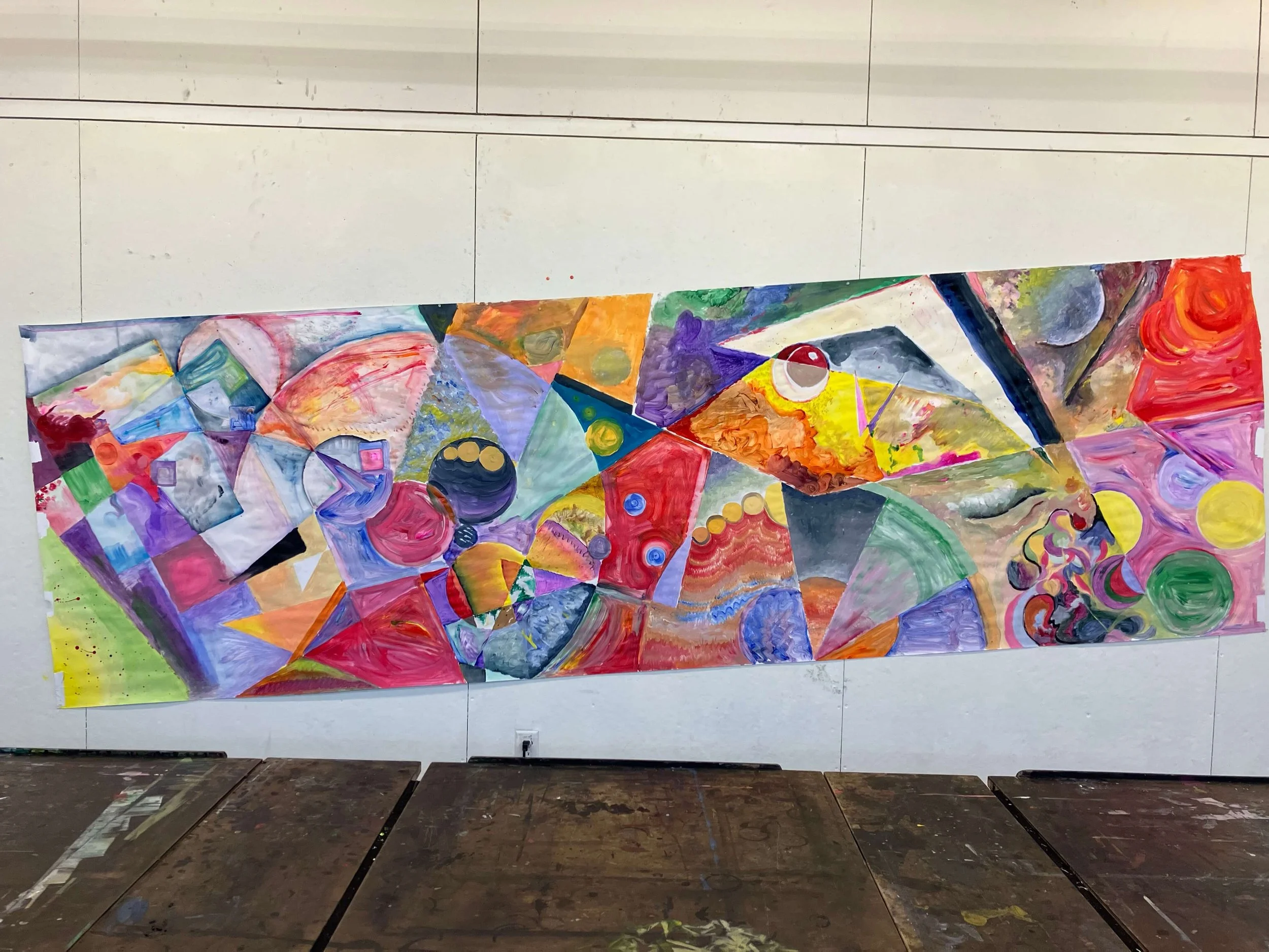 A collaborative student artwork inside Enrique's classroom