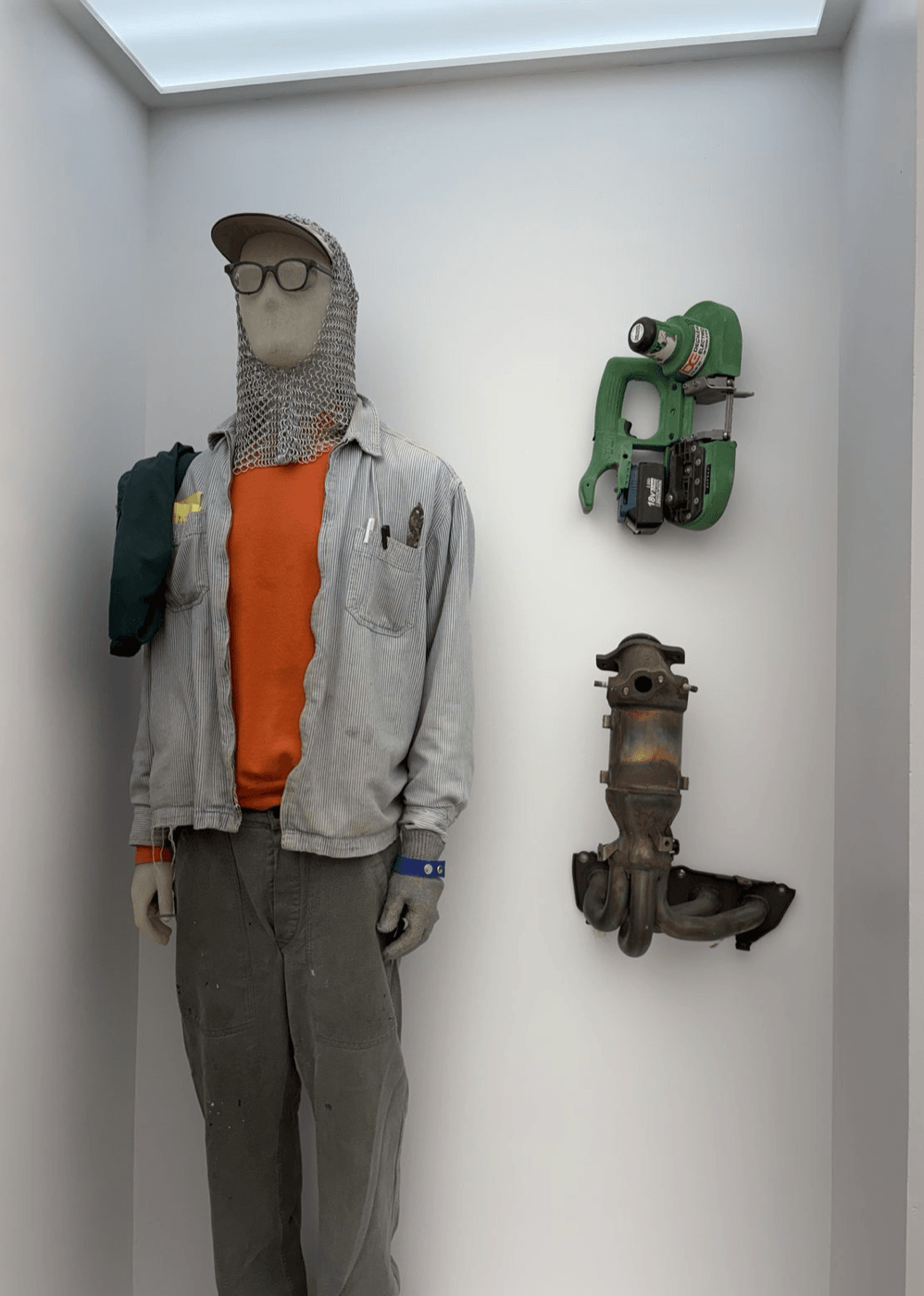 Inset Display, “Artifacts (North America)” includes Mannequin in work clothing and chainmail hood; cordless bandsaw and catalytic converter at right.