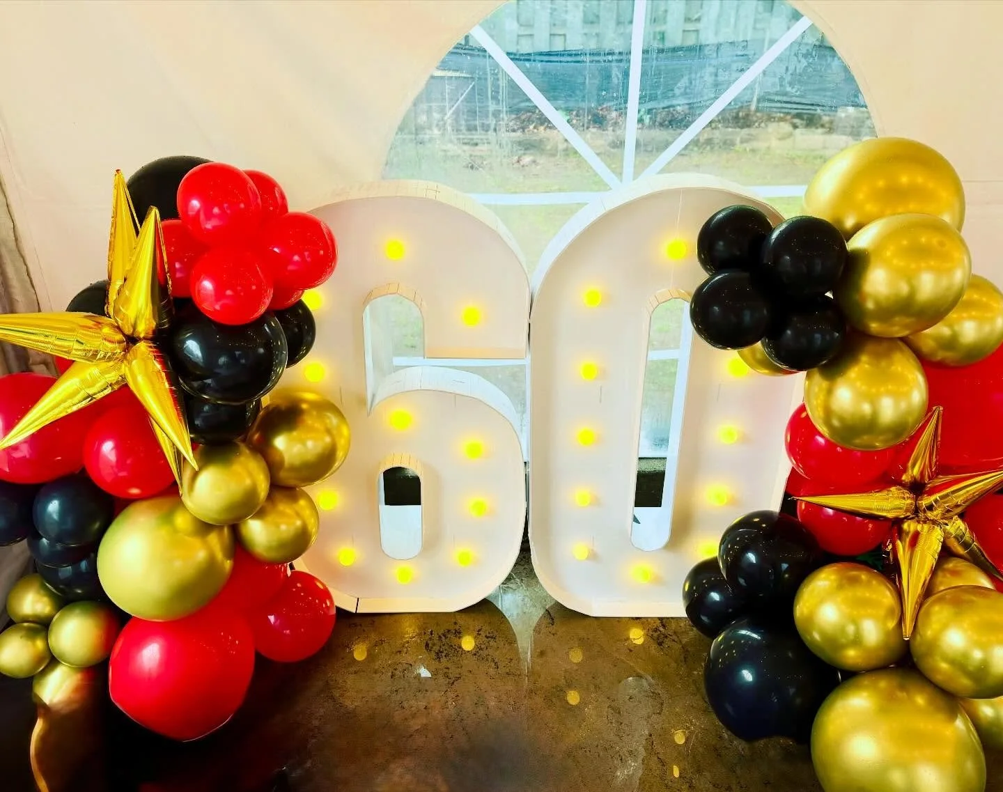 60 &amp; Still Stealing the Spotlight ✨

A milestone deserves a moment&mdash;and this glowing 60 marquee paired with bold cascading balloons in red, black, and luxe gold did exactly that. The perfect statement piece to anchor the celebration.

Ready 