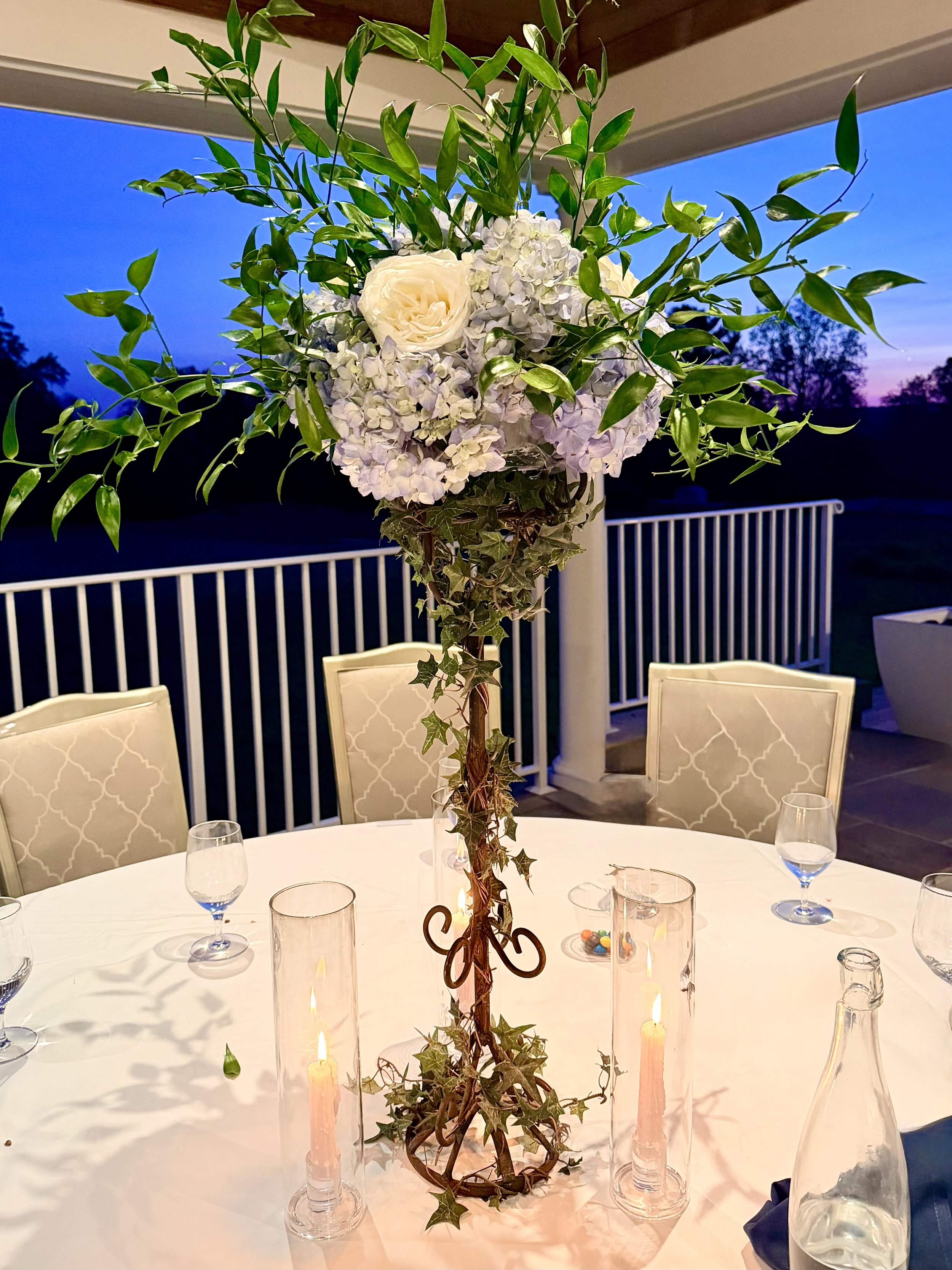 Tall flower centerpiece with Blue Hydrangeas and White Roses in NJ