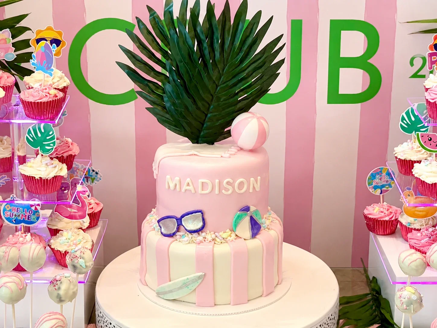 Luxury Beach Club birthday cake with custom dessert display featuring cupcakes and cake pops for a children's birthday party in New Jersey by Stellar View Events.