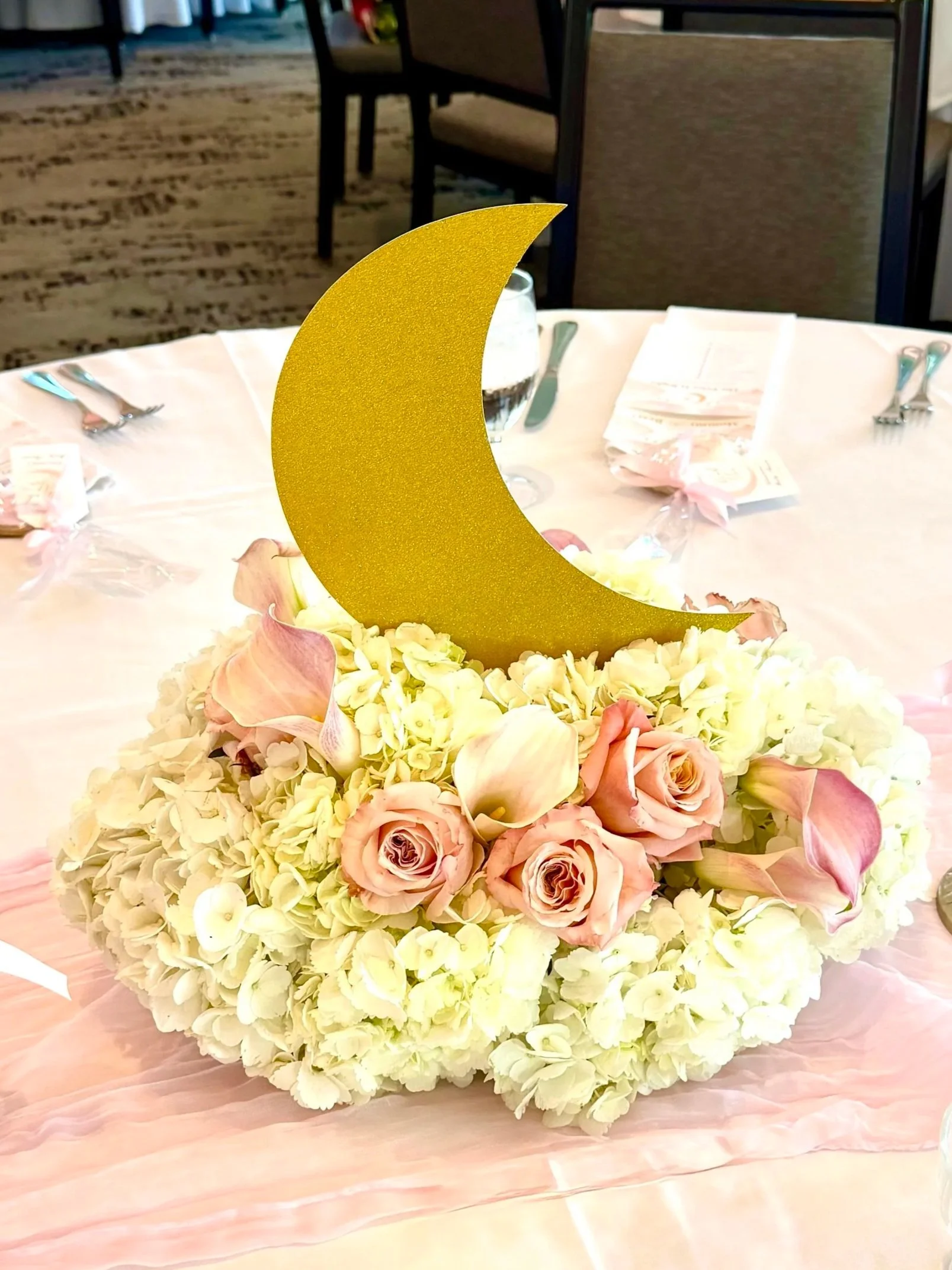 Luxury baby shower designed with elegant wedding-inspired décor, florals, and balloon installations